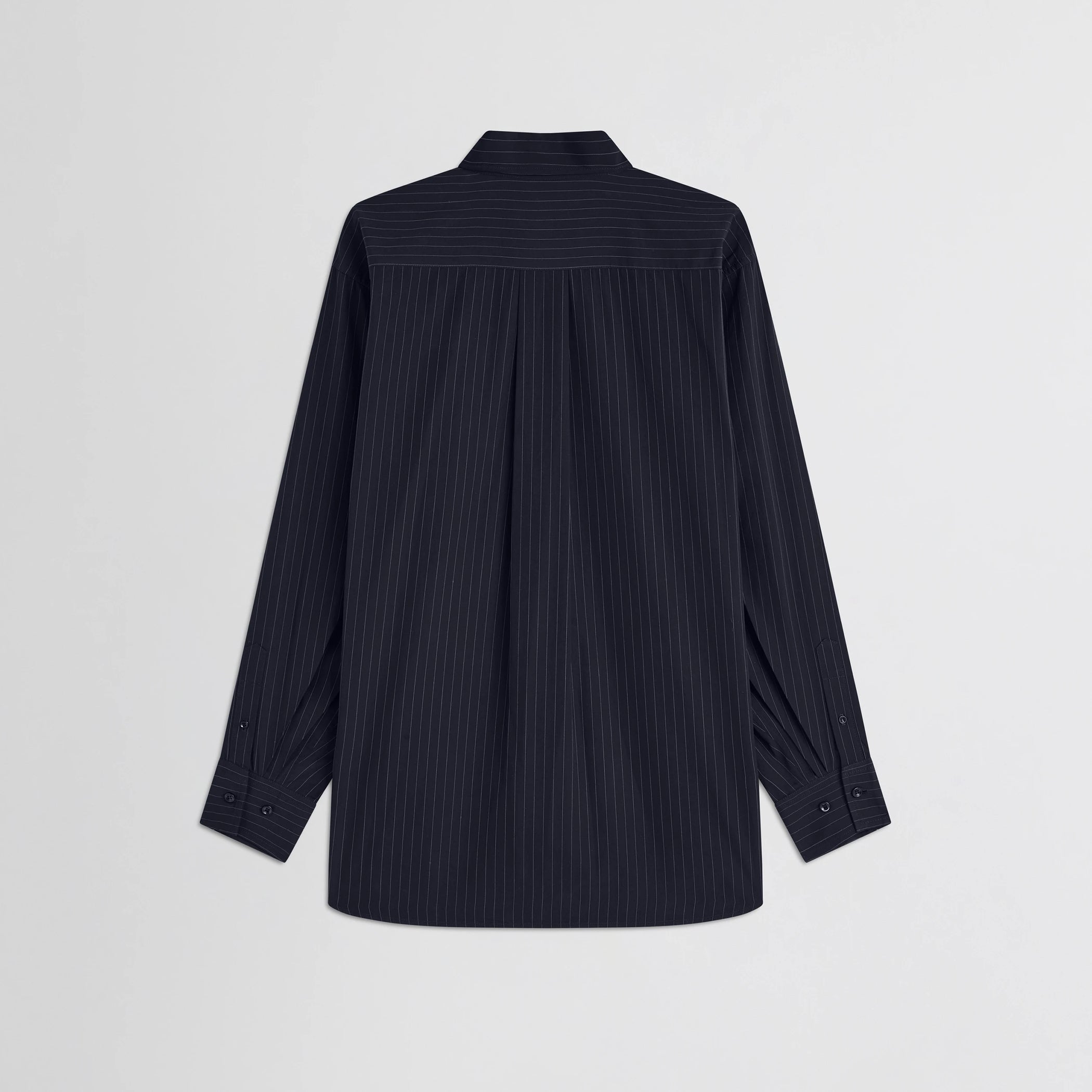 Flat back view of button collar shirt in midnight pinstripe cotton.