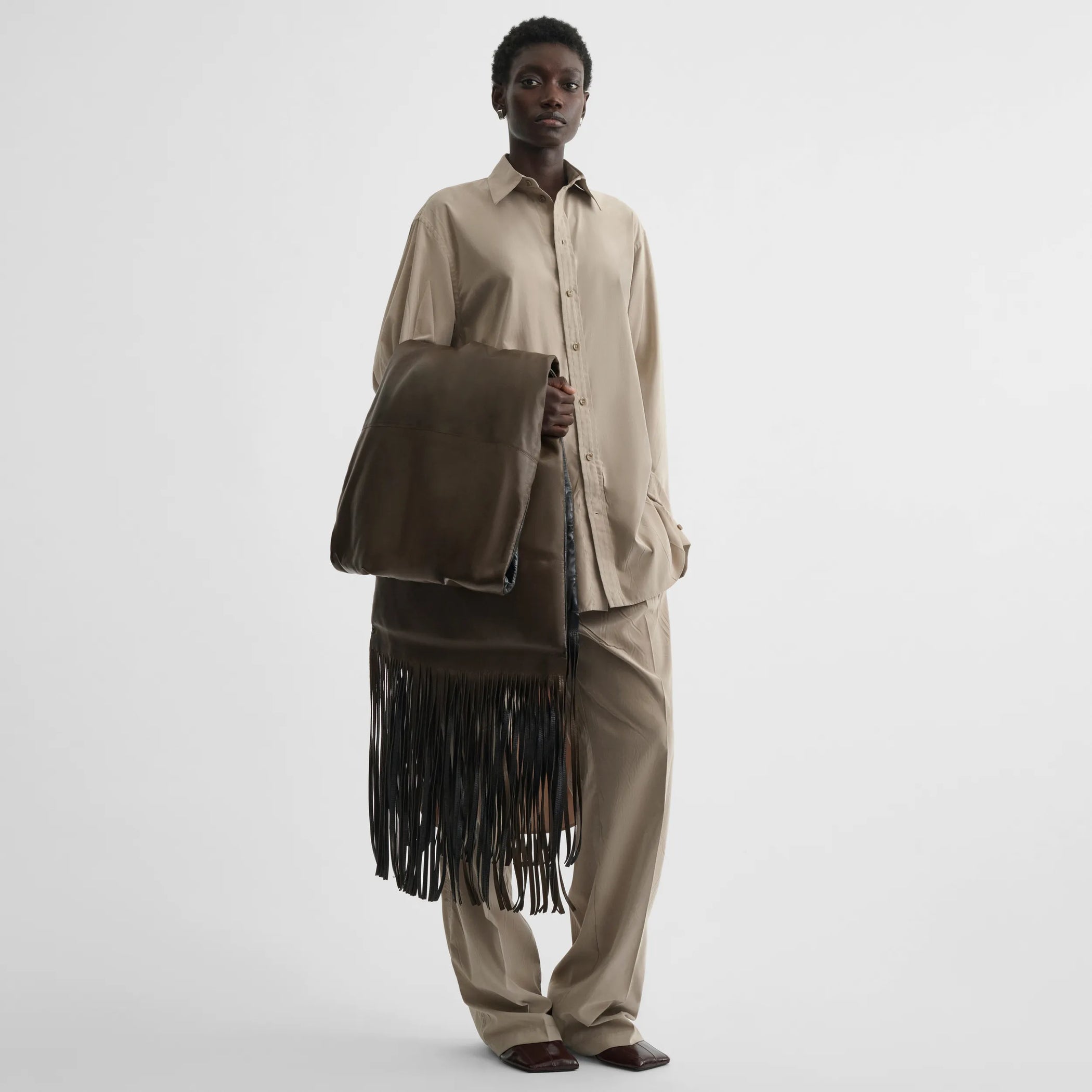 Flat front view of elongated shirt in trench cotton