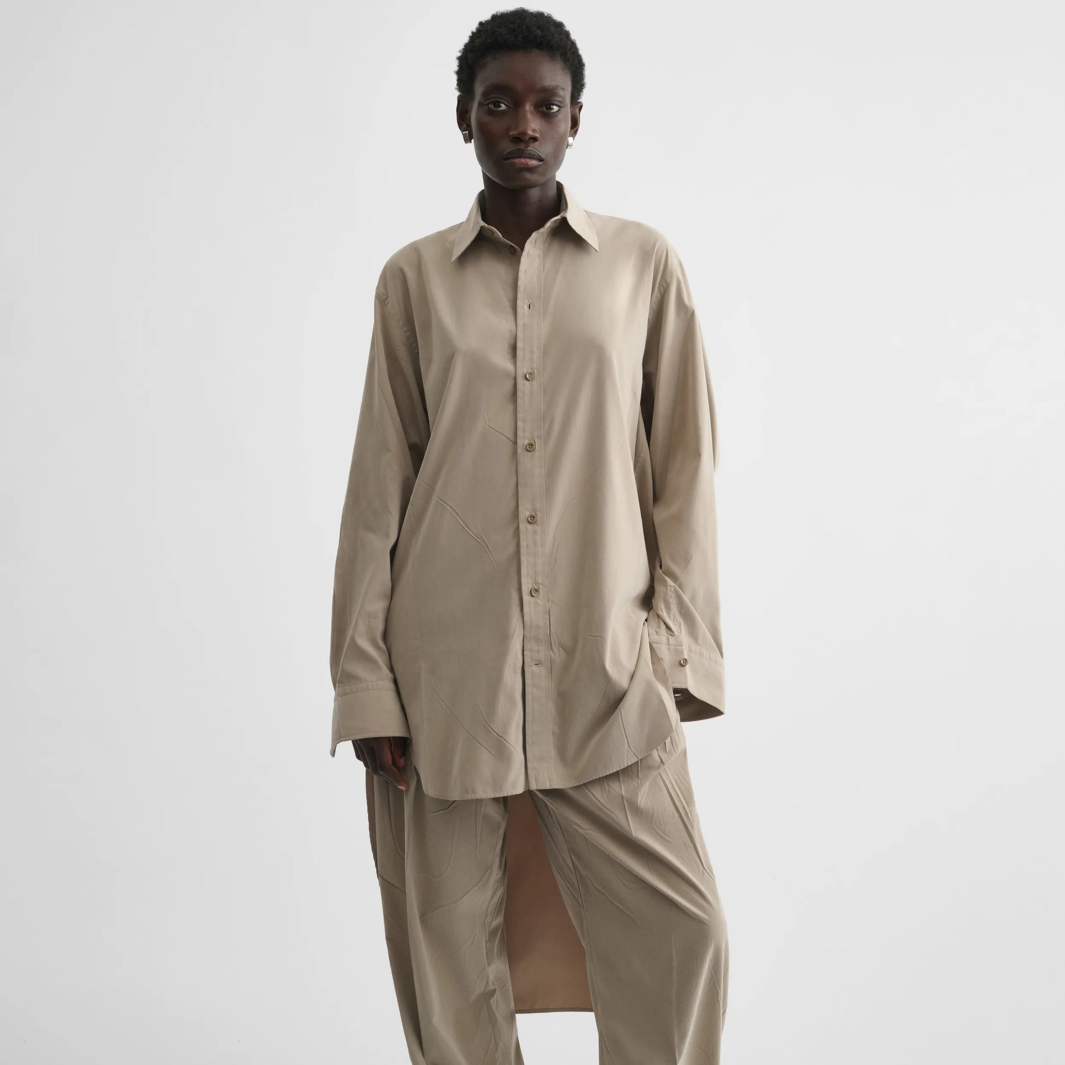 Flat front view of elongated shirt in trench cotton