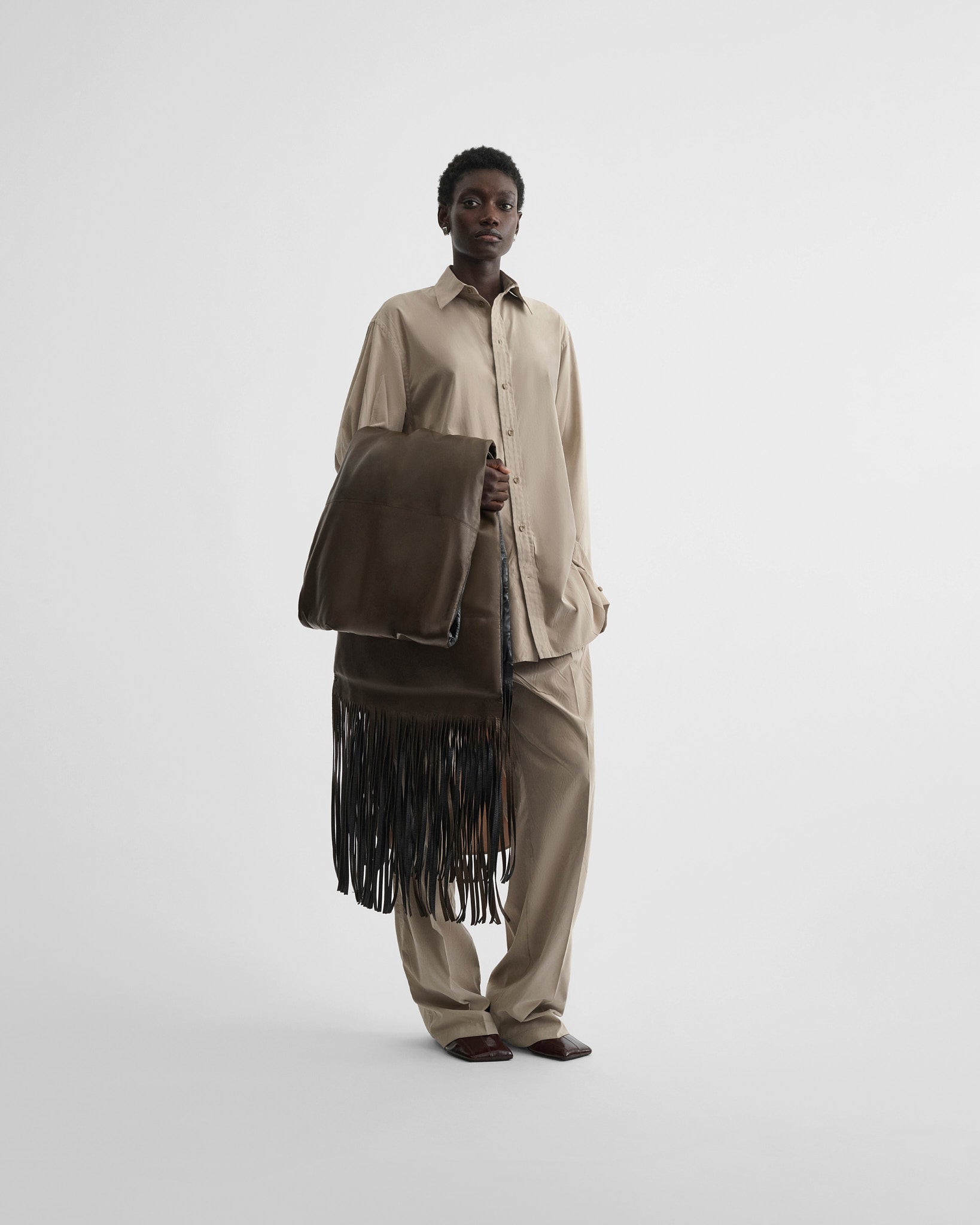 View of elongated shirt in trench poly-twill