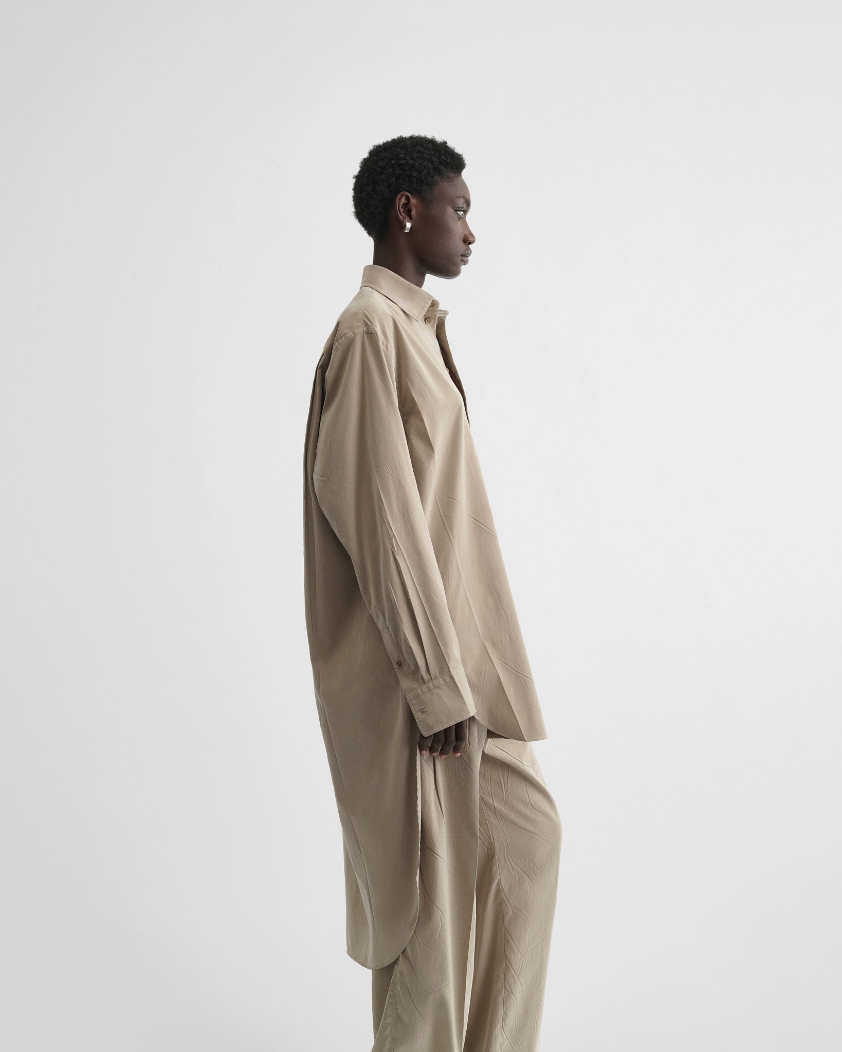 View of elongated shirt in trench poly-twill