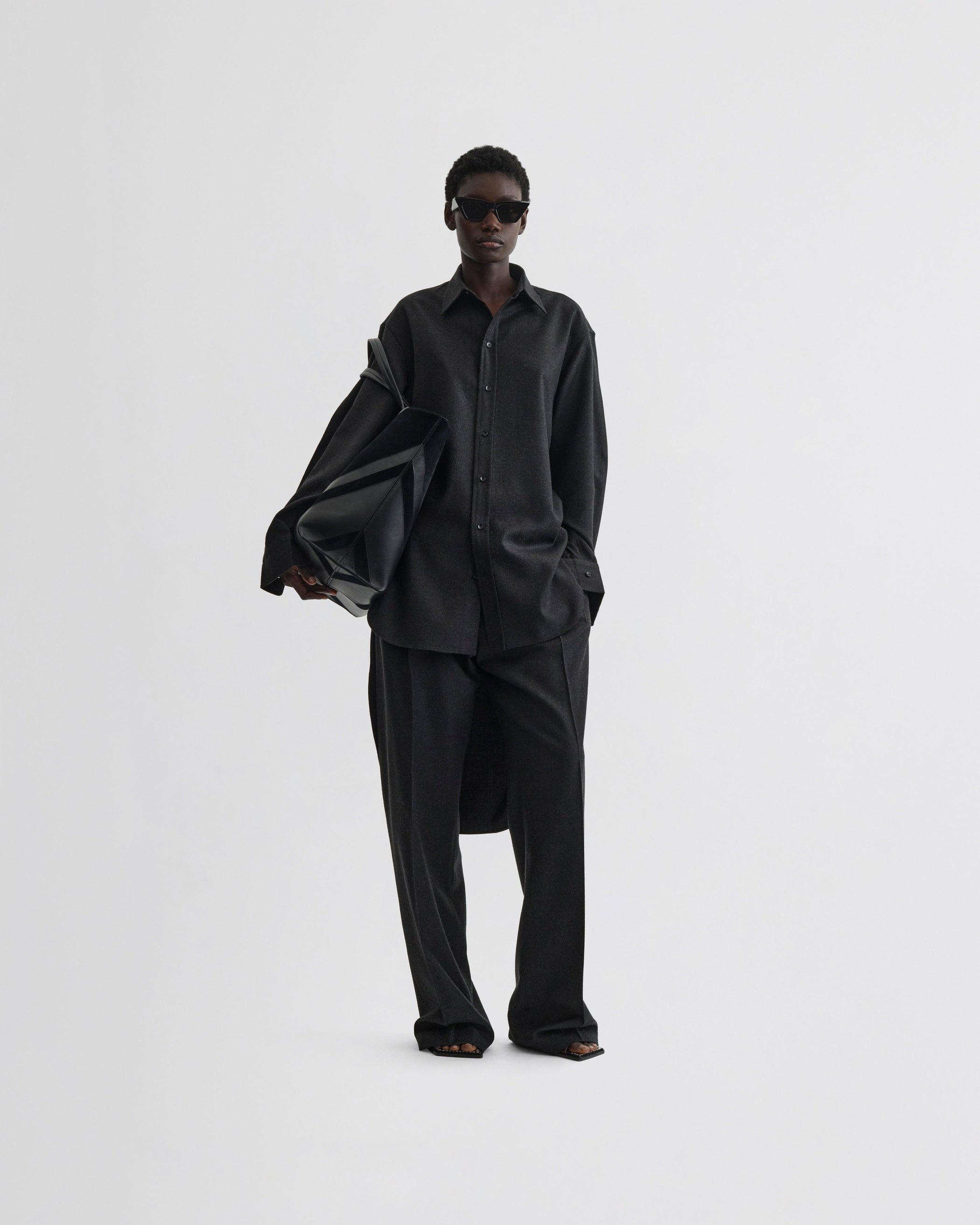 View of elongated shirt in charcoal wool