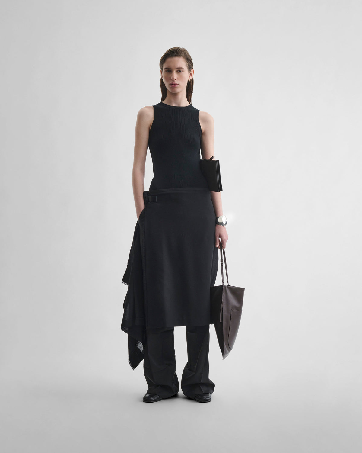 Front view of model wearing KILT in black wool