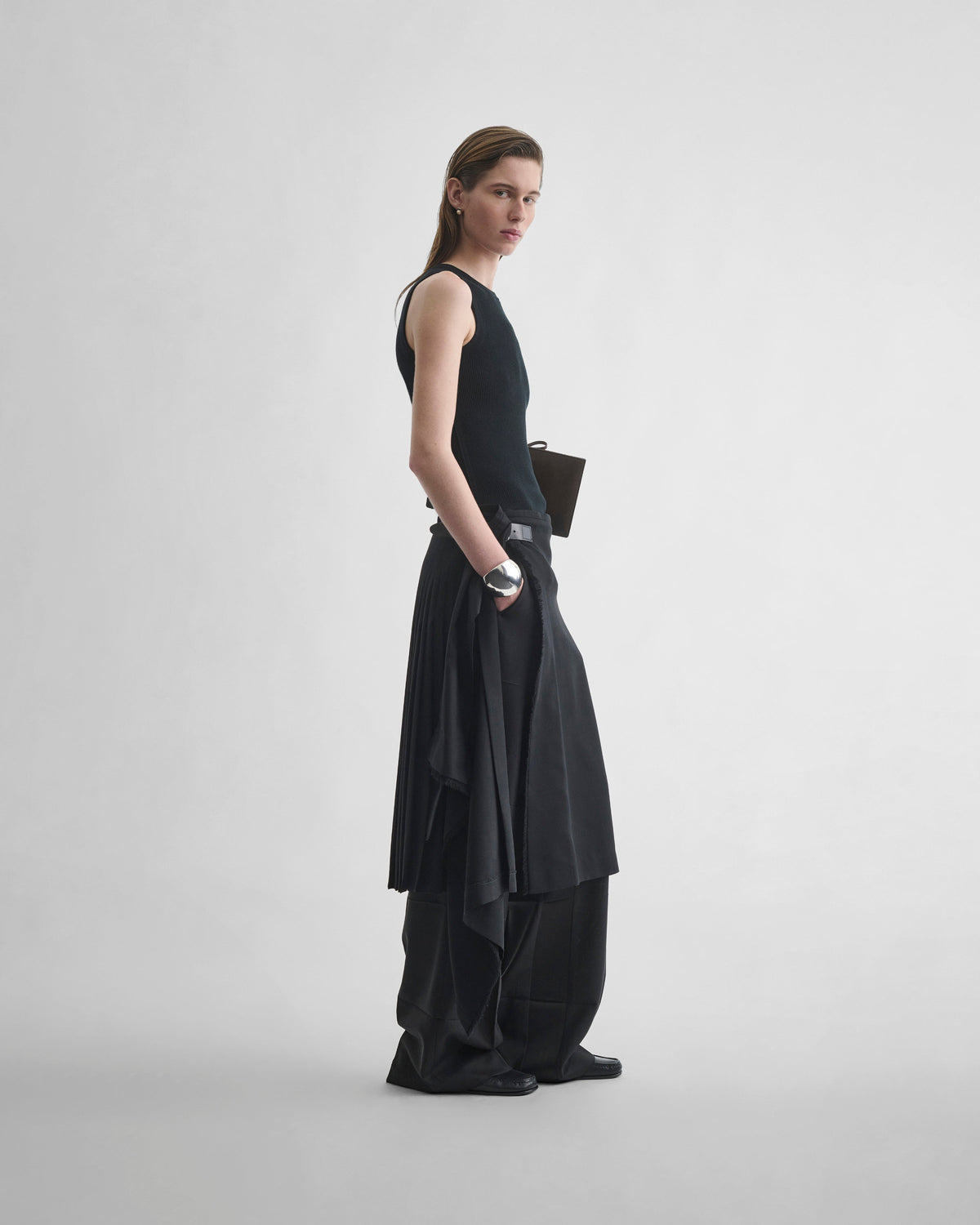 Side view of model wearing KILT in black wool