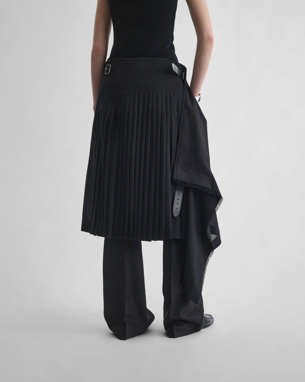Back view of model wearing KILT in black wool