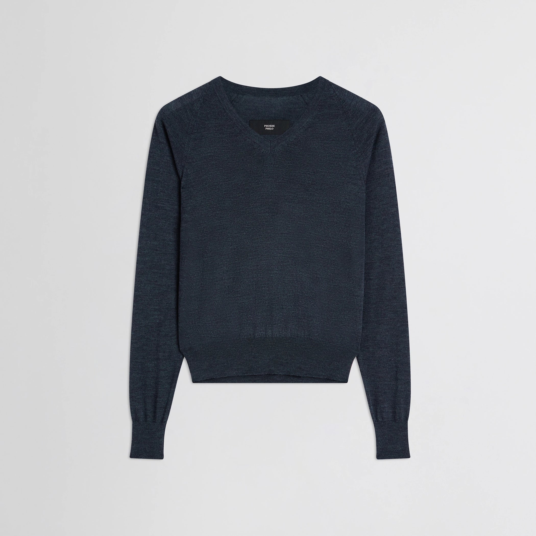 Flat front view of shrunk v-neck in dark blue melange wool.