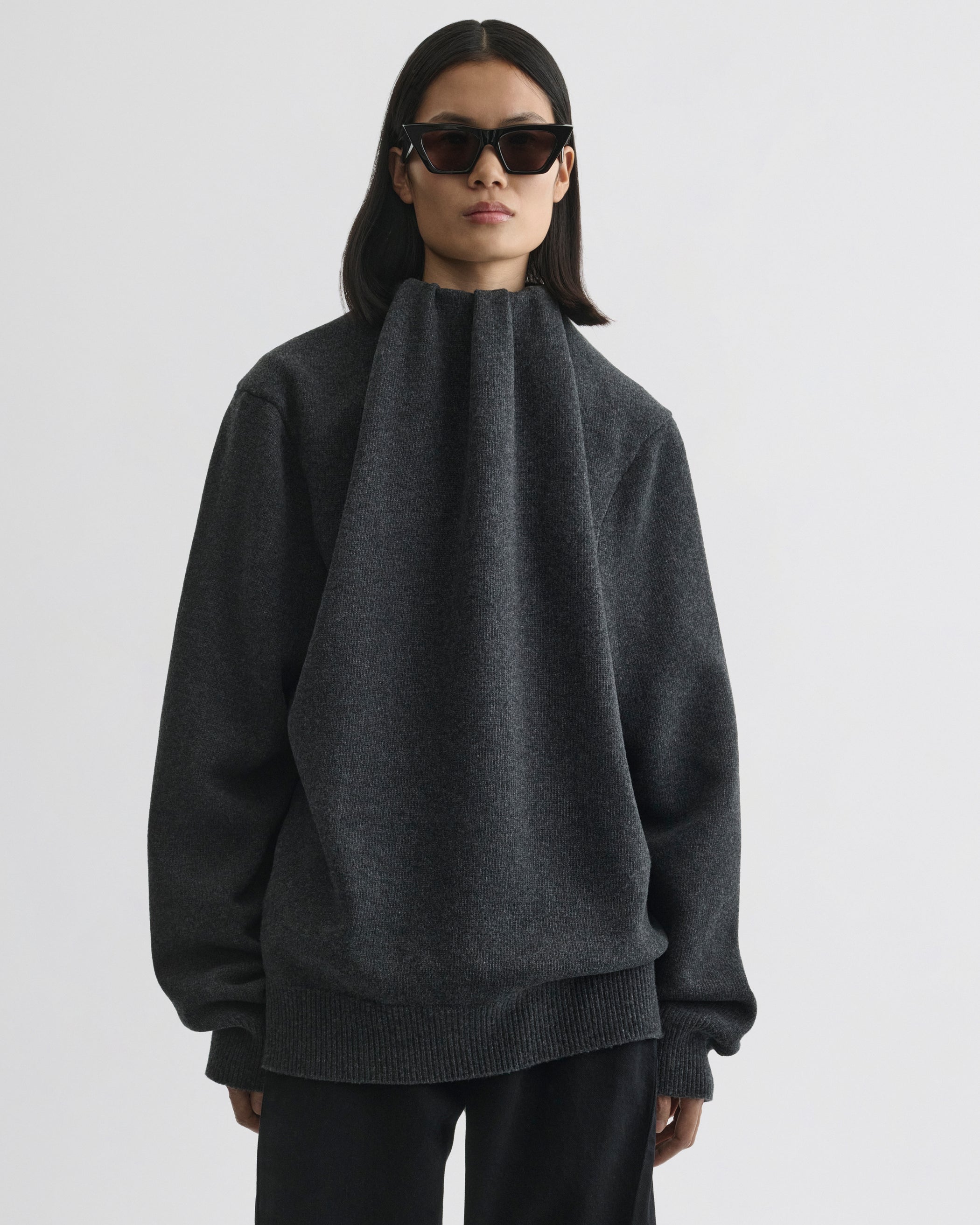 Front view of model wearing SOFT RIDGE JUMPER in grey melange wool