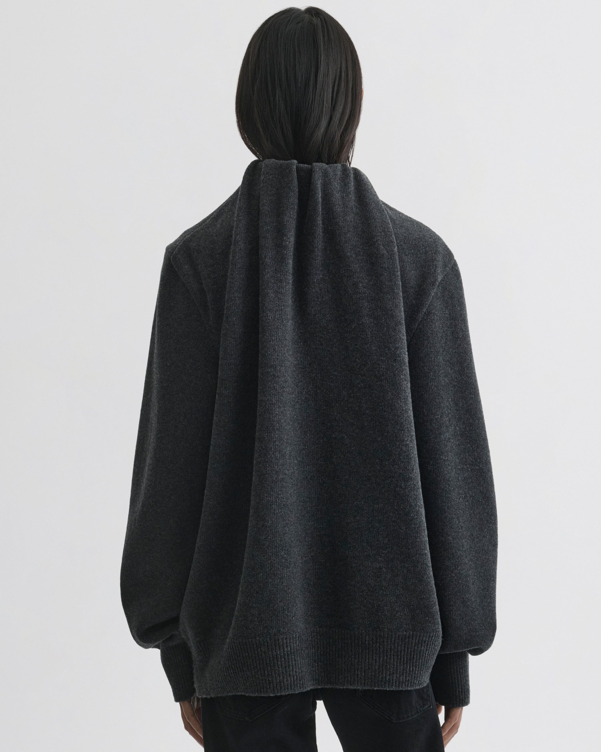 Back view of model wearing SOFT RIDGE JUMPER in grey melange wool