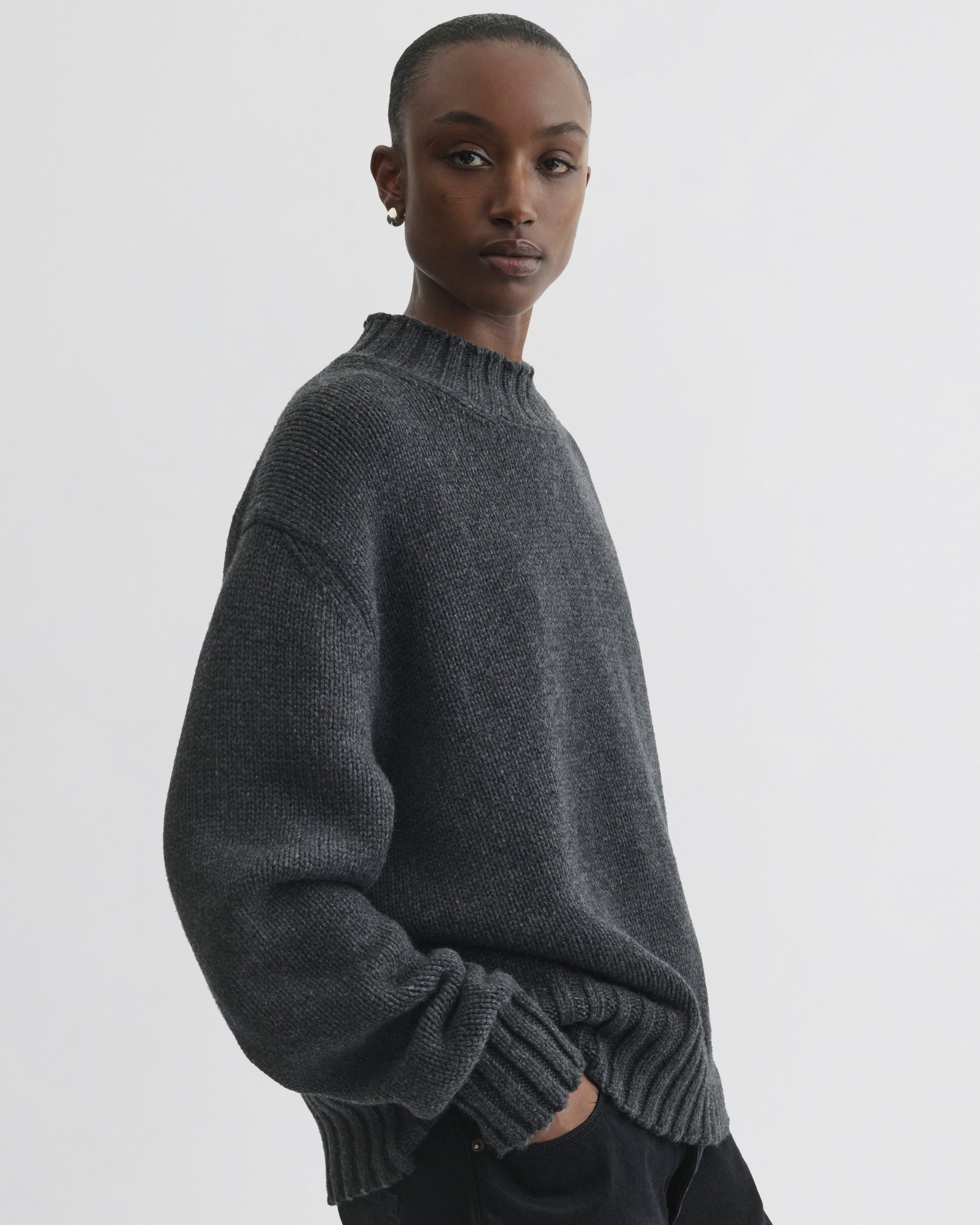 Side view of model wearing Crewneck Jumper in grey cashmere