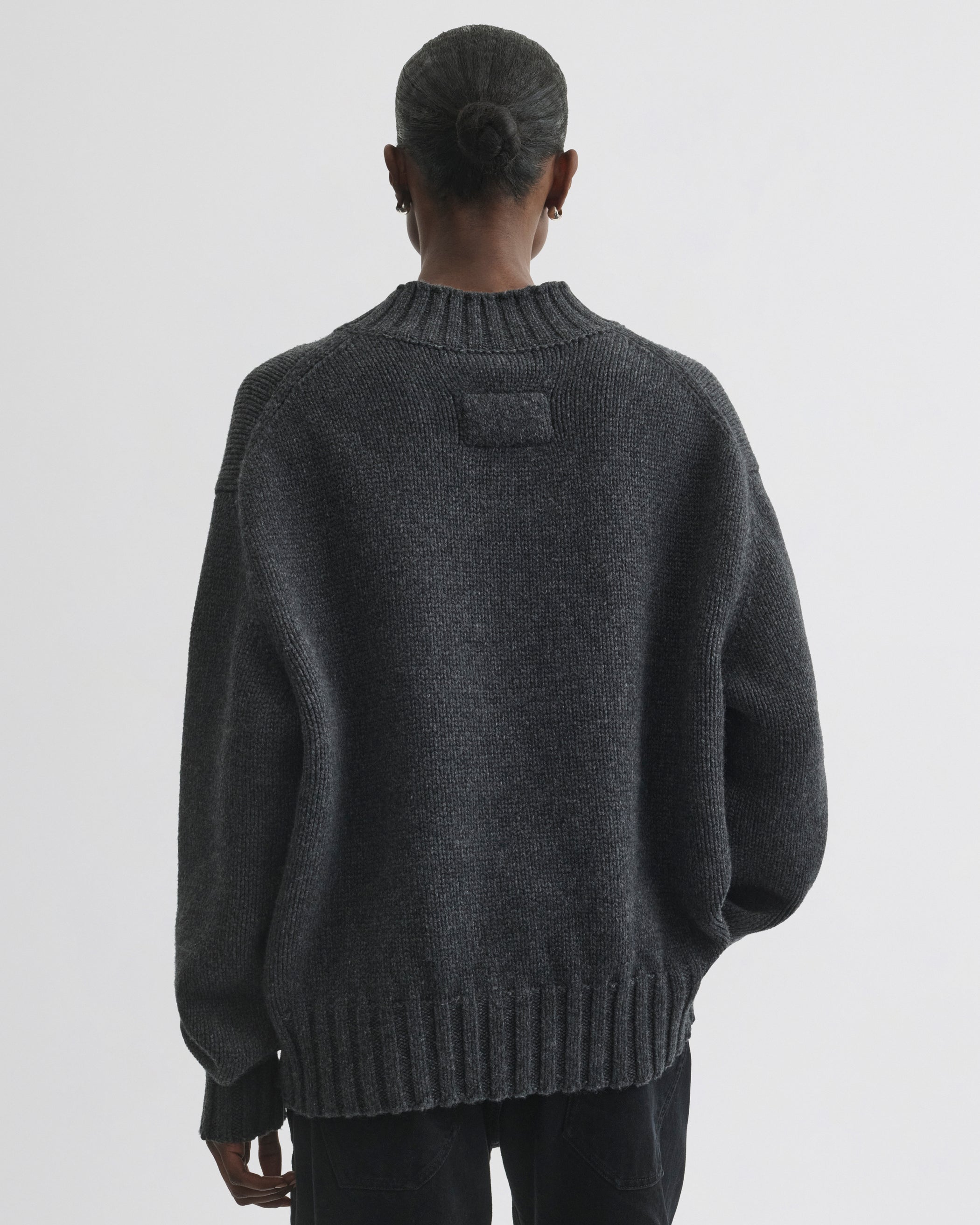 Back view of model wearing Crewneck Jumper in grey cashmere