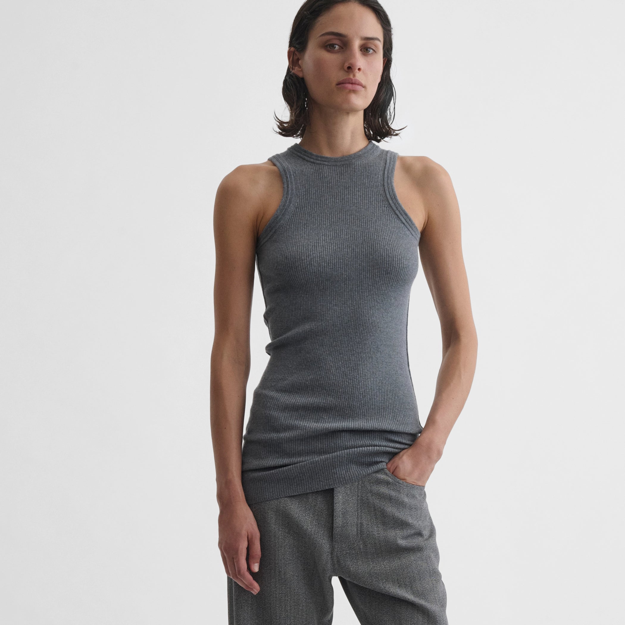 Front view of model wearing ribbed tank in grey wool