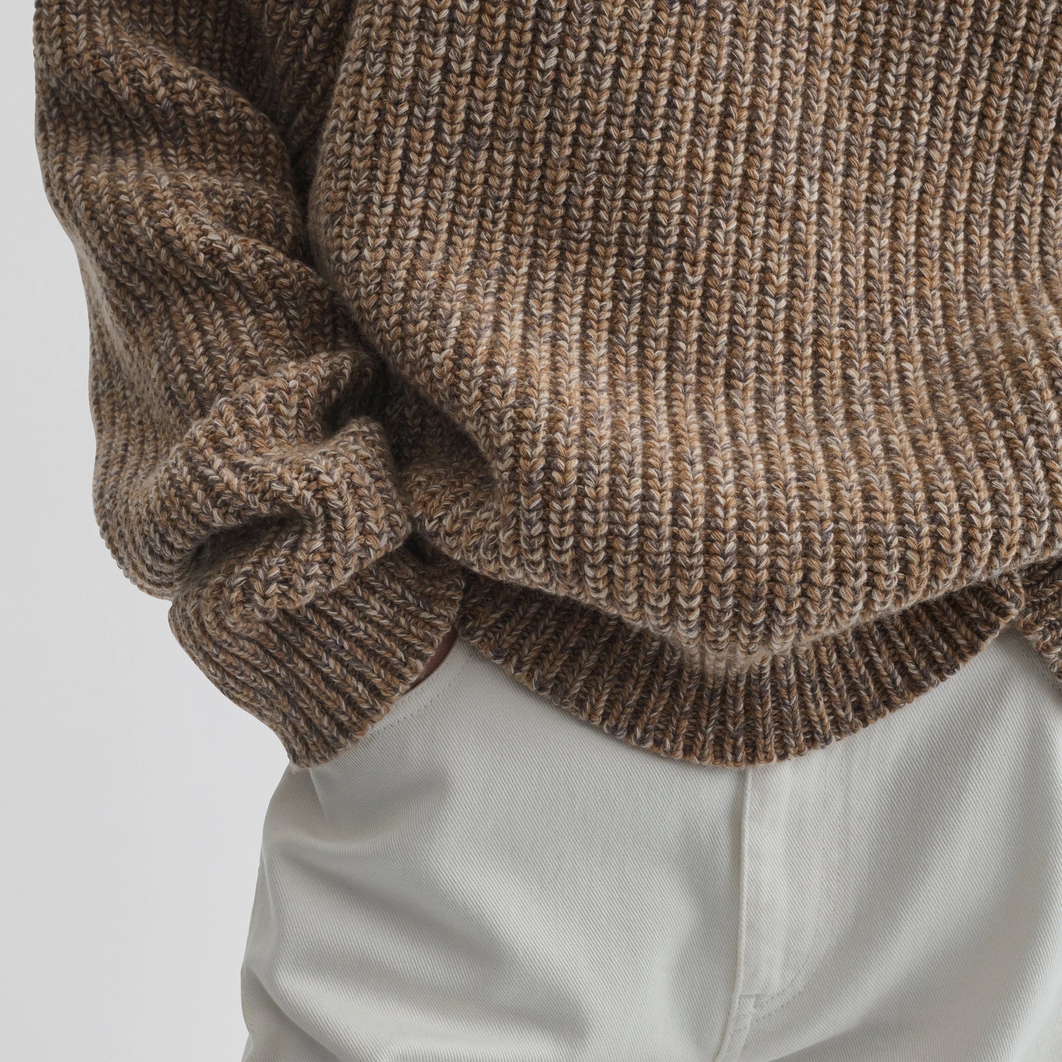 Close up detail view of mouline jumper in camel wool.