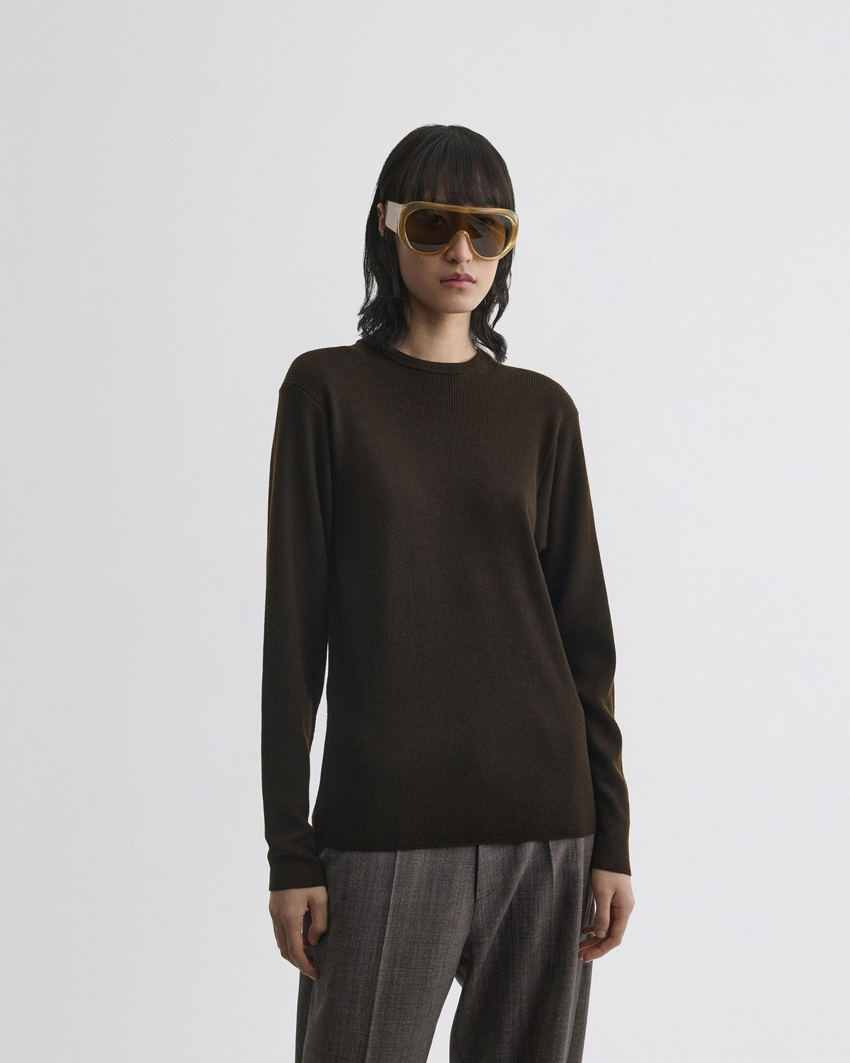 Close front view of model wearing RIBBED LONG SLEEVE CREWNECK in dark khaki wool