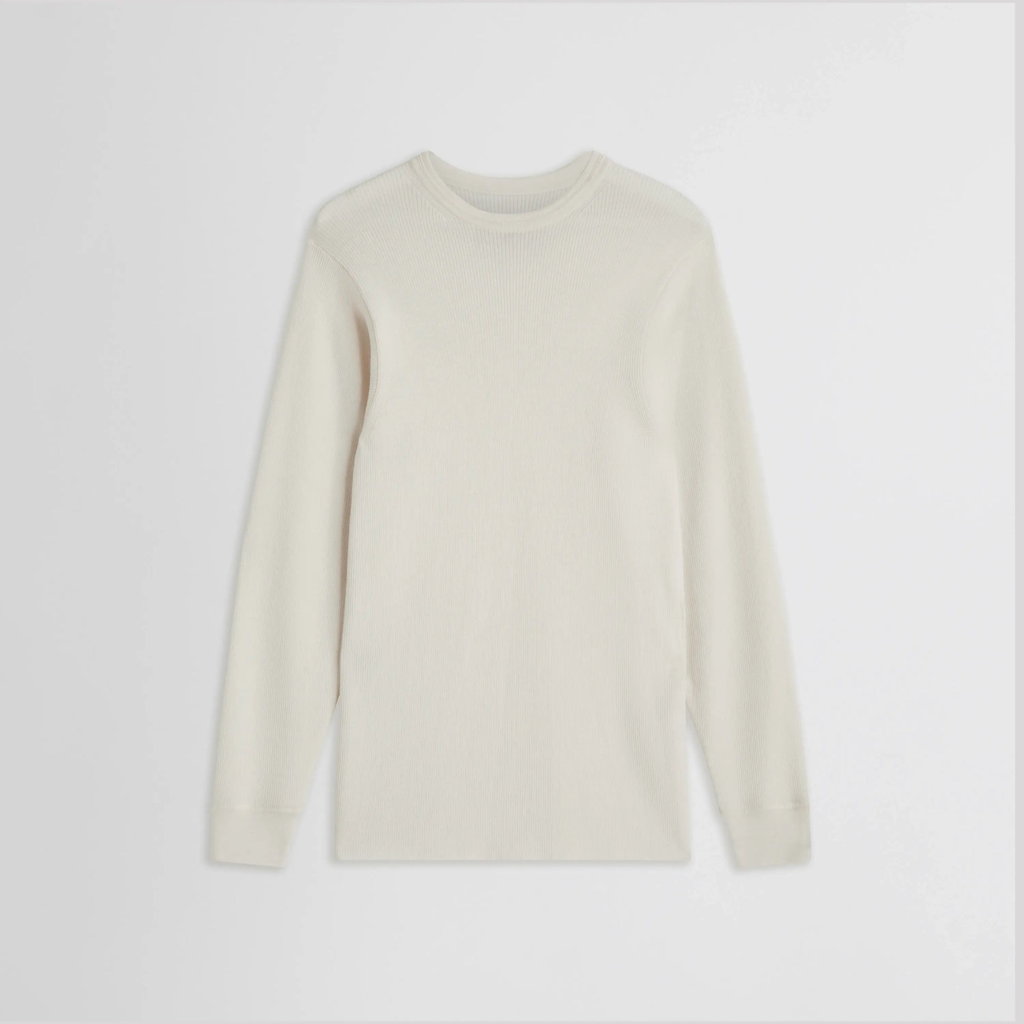 Front flat lay of Ribbed Long Sleeve Crewneck in cream. 