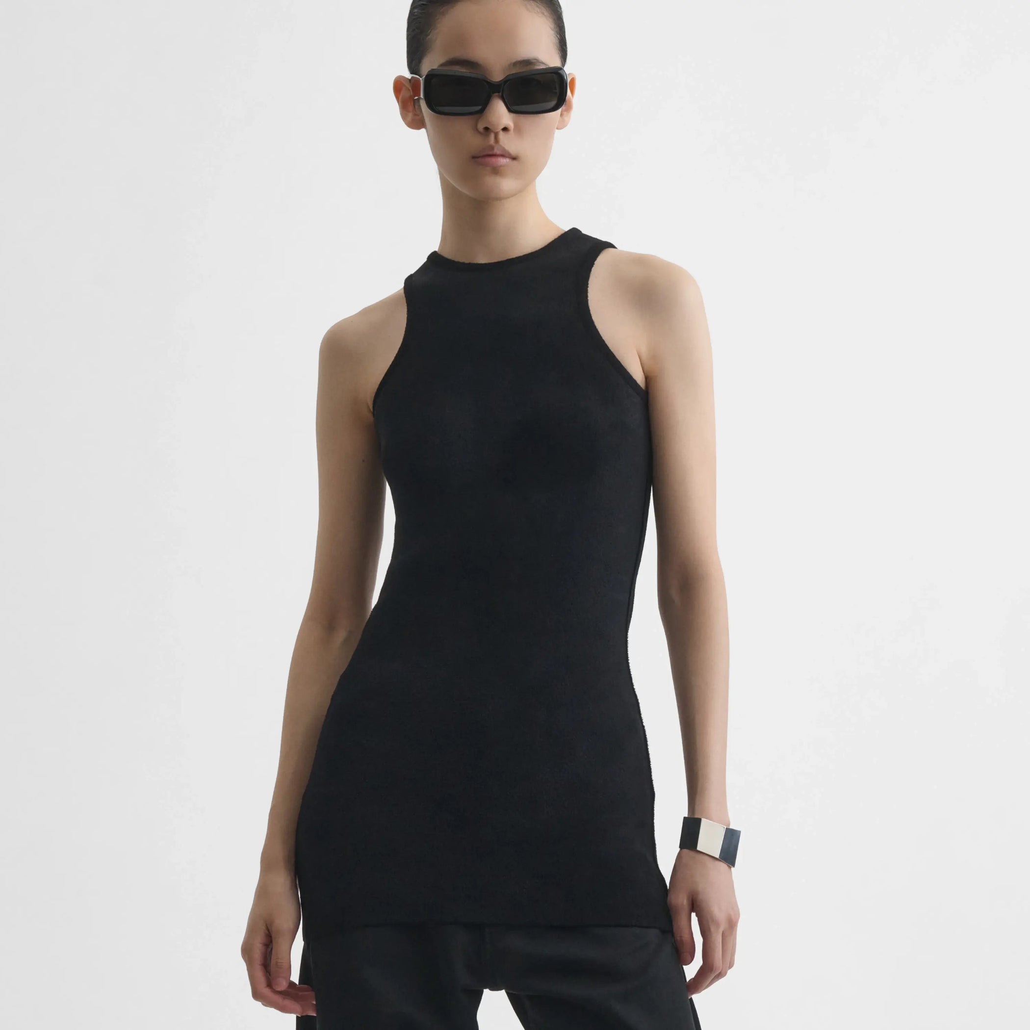 Front view of model wearing Tank Top in black.