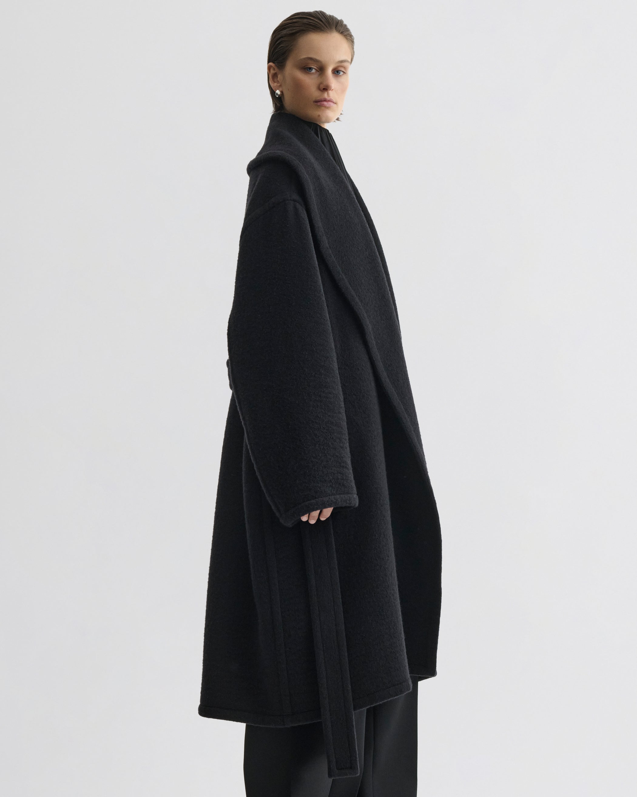 Side view of model wearing ROBE COAT in black cashmere