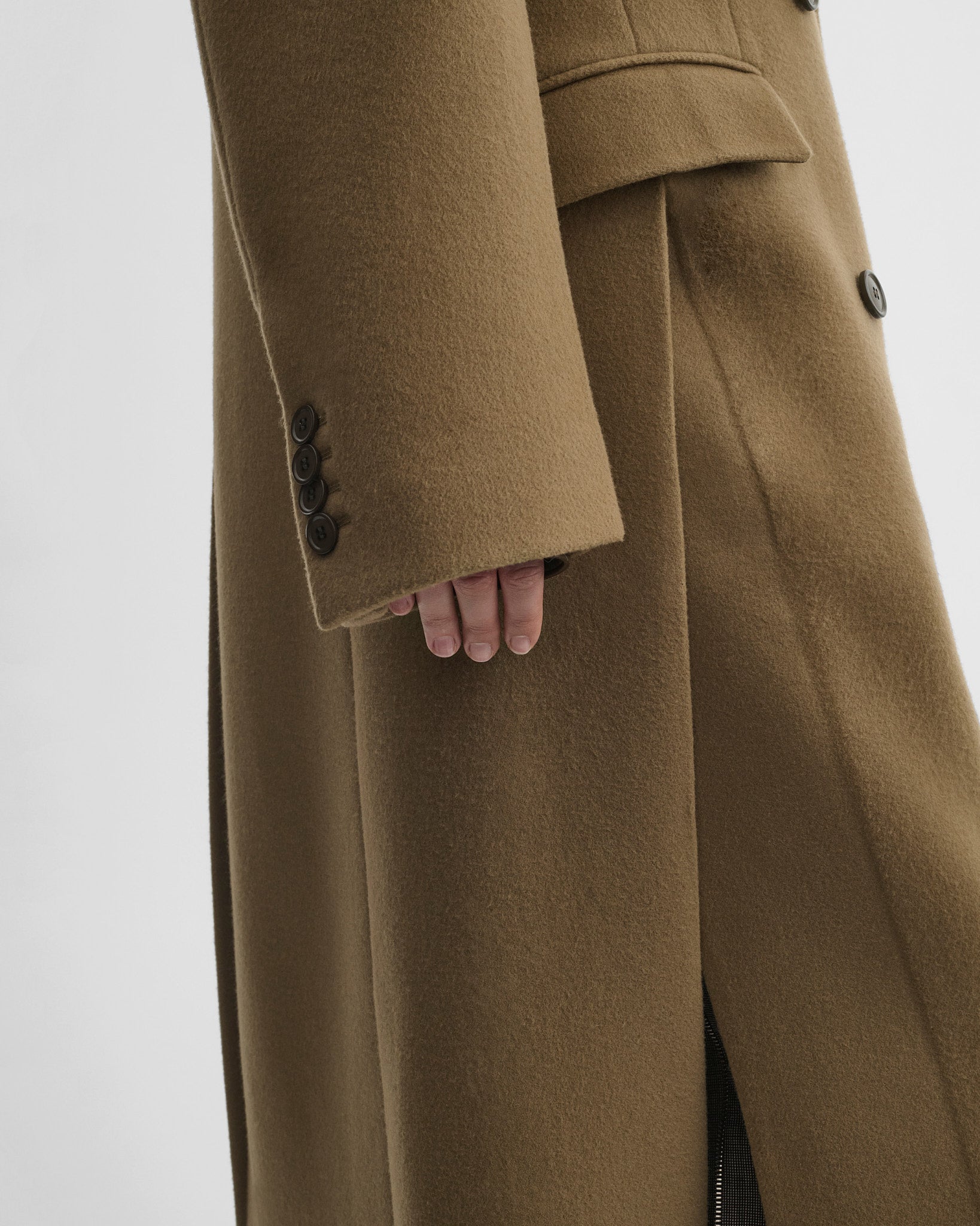 Side close up detail view of man's coat in tobacco cashmere