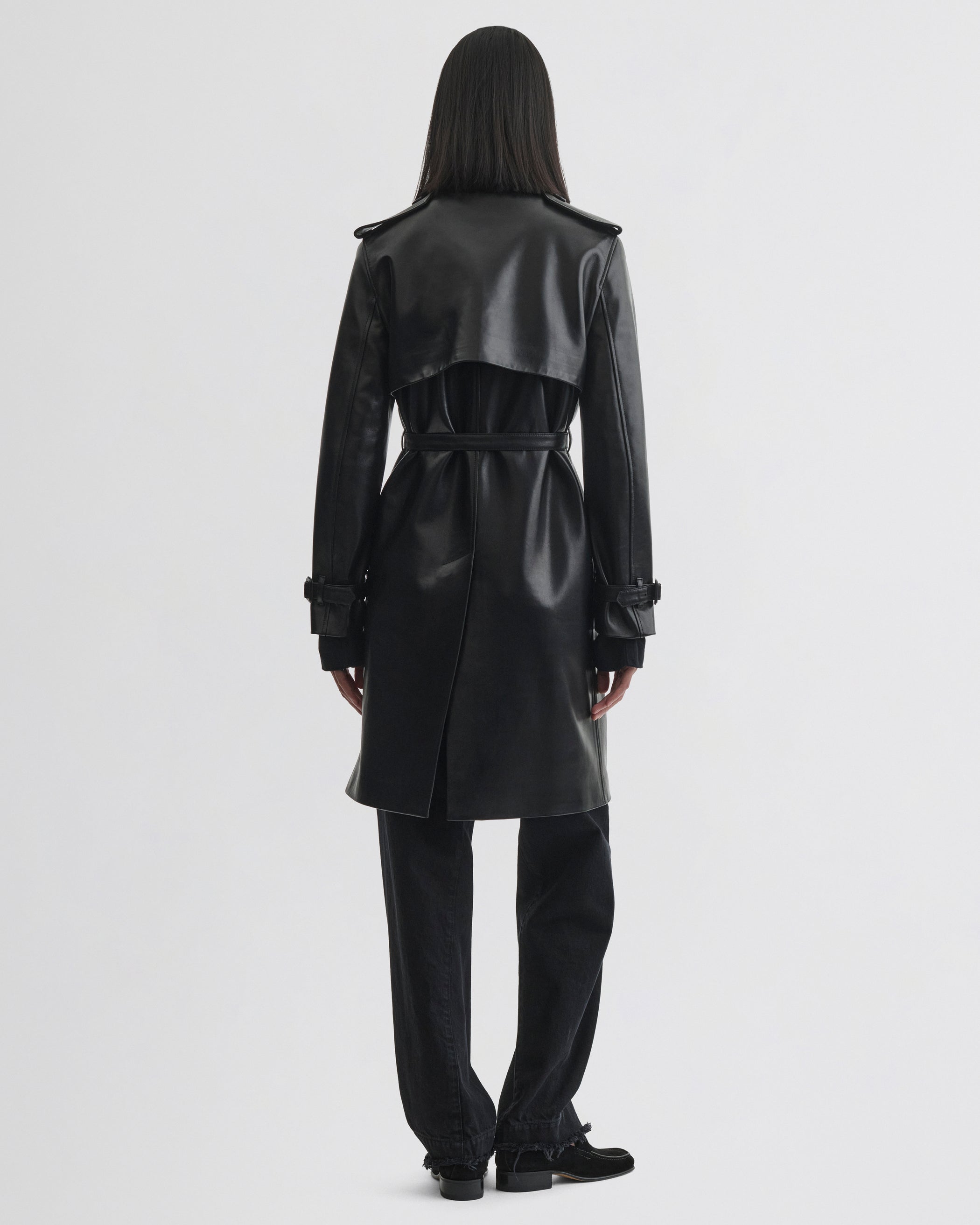 Back view of model wearing Short Trench in black leather