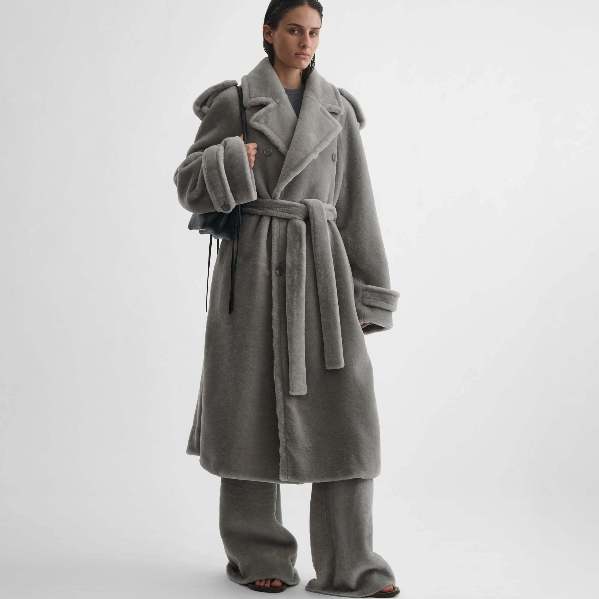 Full body front view of model wearing teddy trench coat in grey