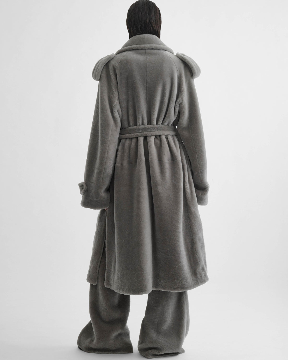 Flat view of model wearing TEDDY TRENCH COAT in grey shearling