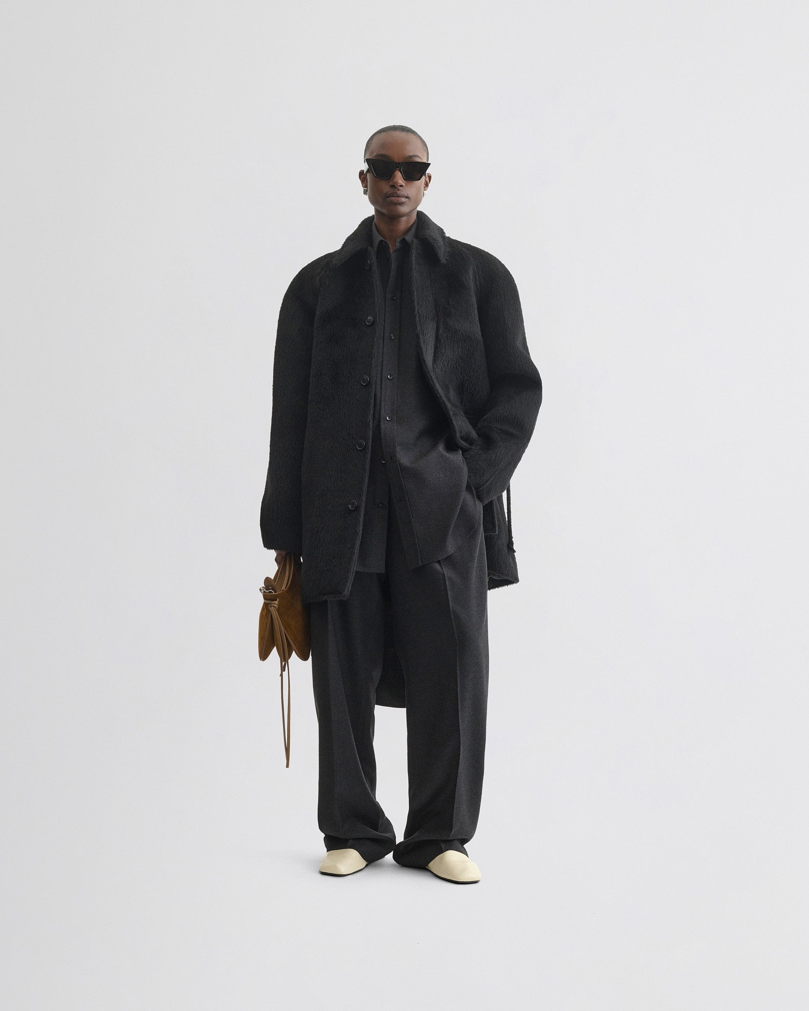 Front view of model wearing Cropped Car Coat in black alpaca wool