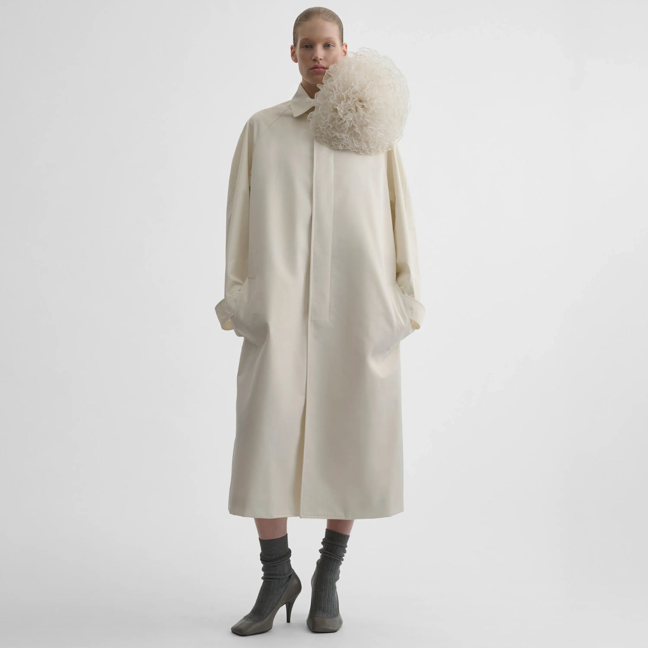 Full body front view of model wearing Comfy Car Coat in white blonde.