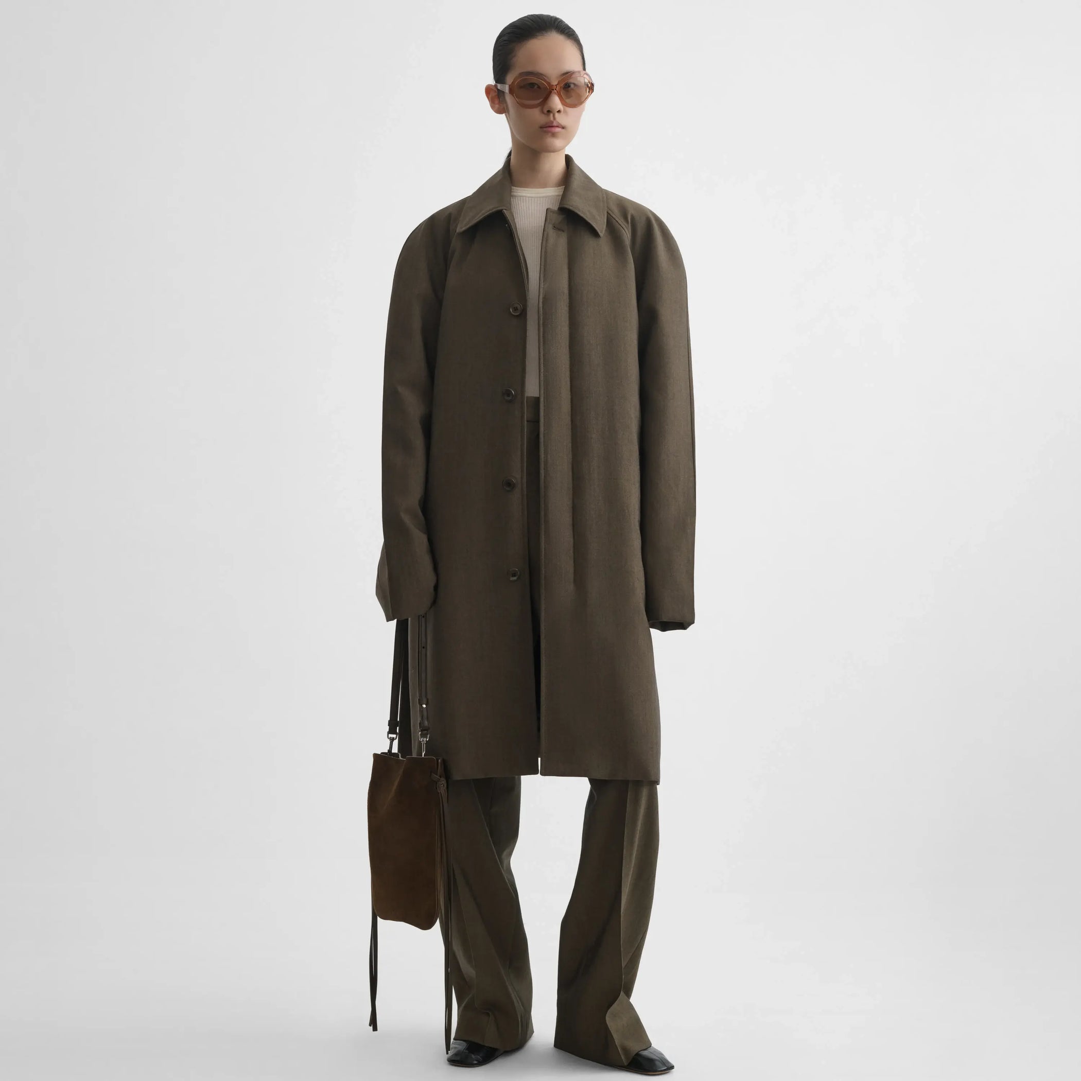 Full body front view of model wearing Padded Car Coat in tobacco.