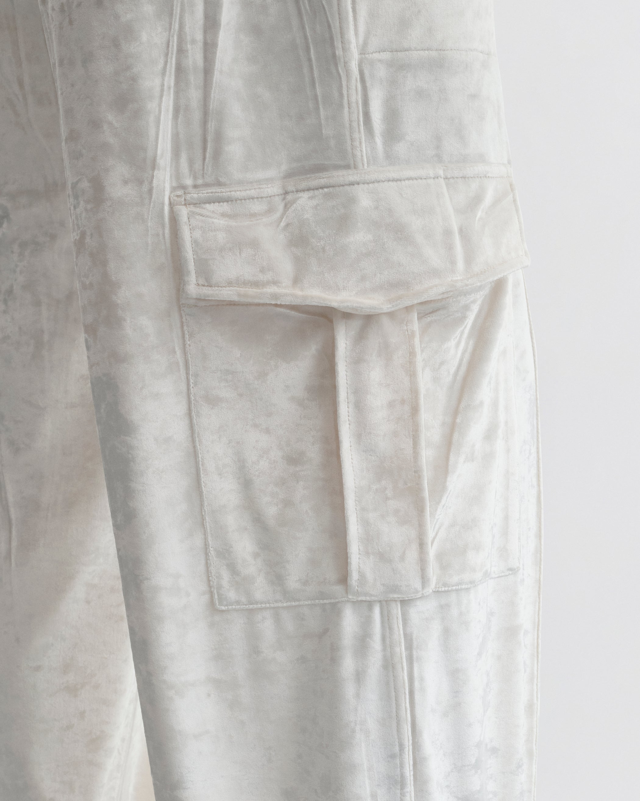 Close up detail view of LIQUID CARGO TROUSERS  in white crushed velvet