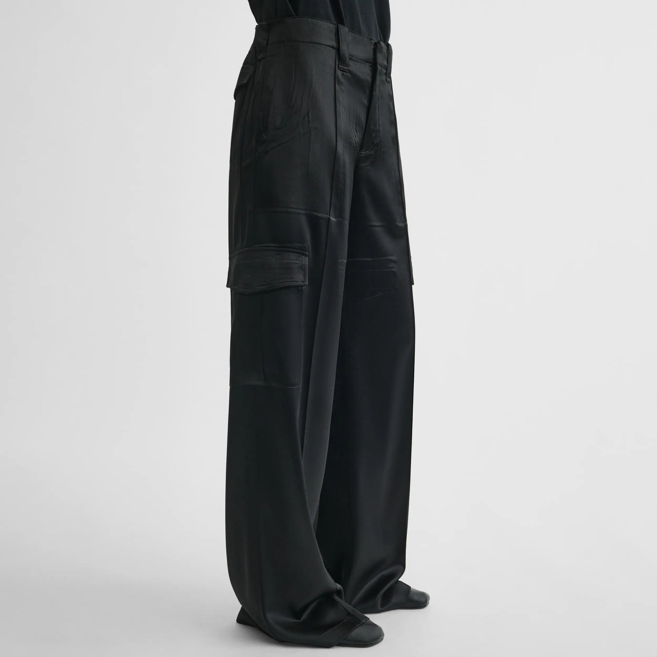 Side view of liquid cargo trousers in black silk