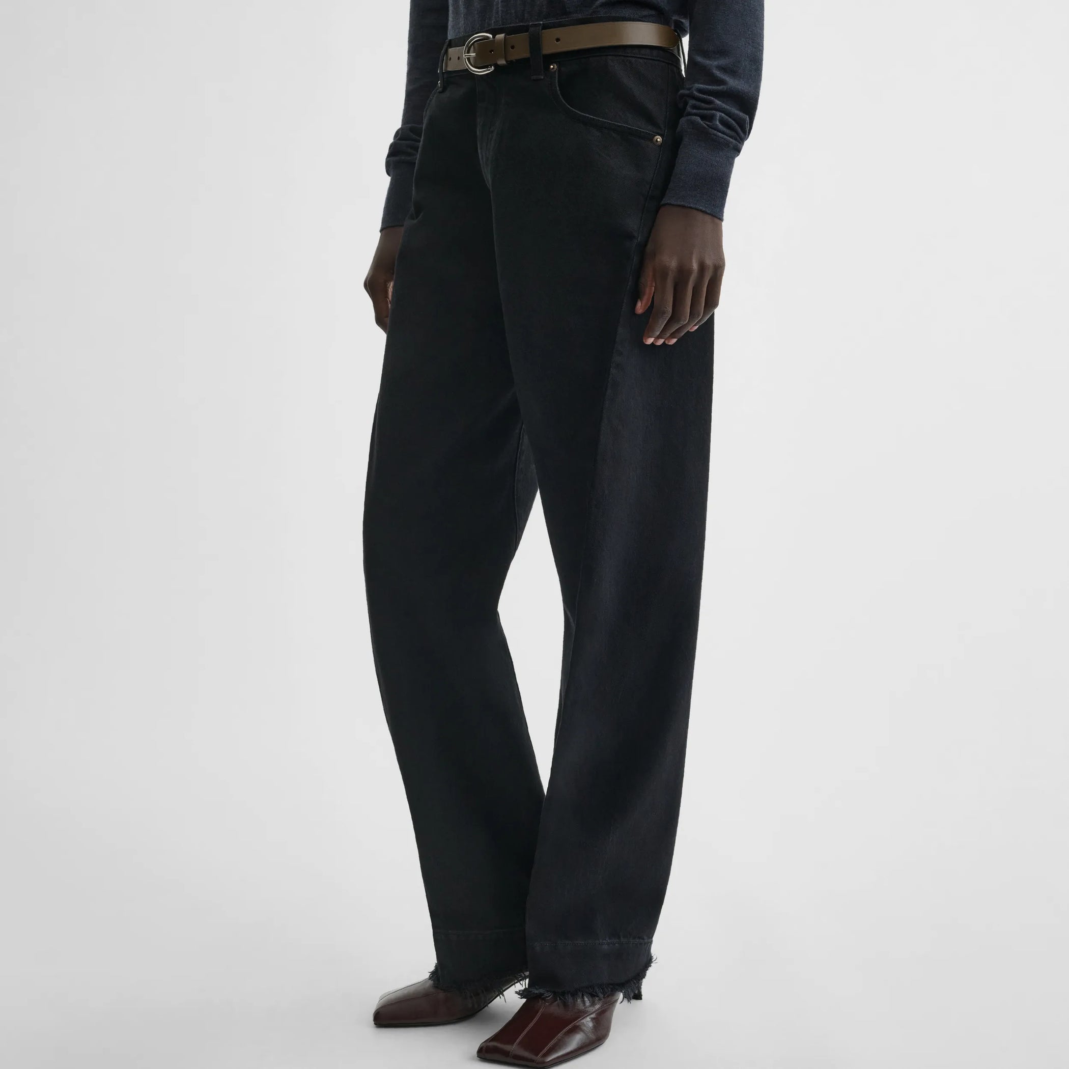 Side view of arch jeans in black cotton