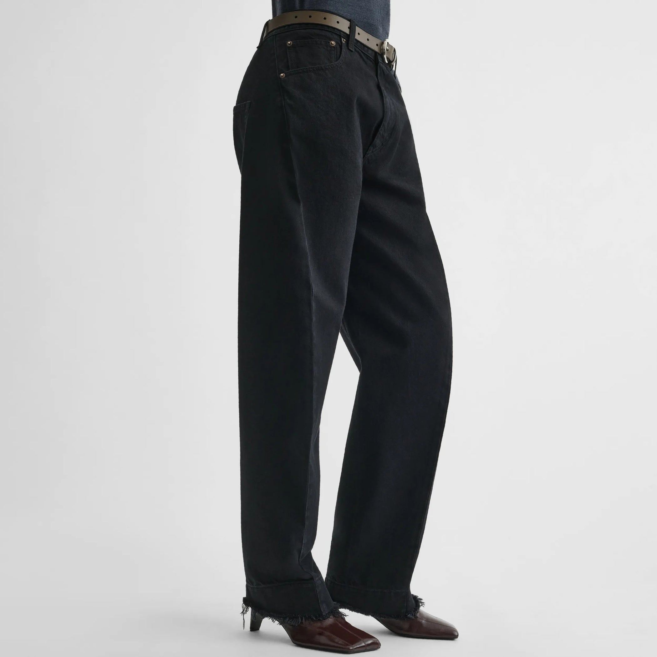 Side view of arch jeans in black cotton