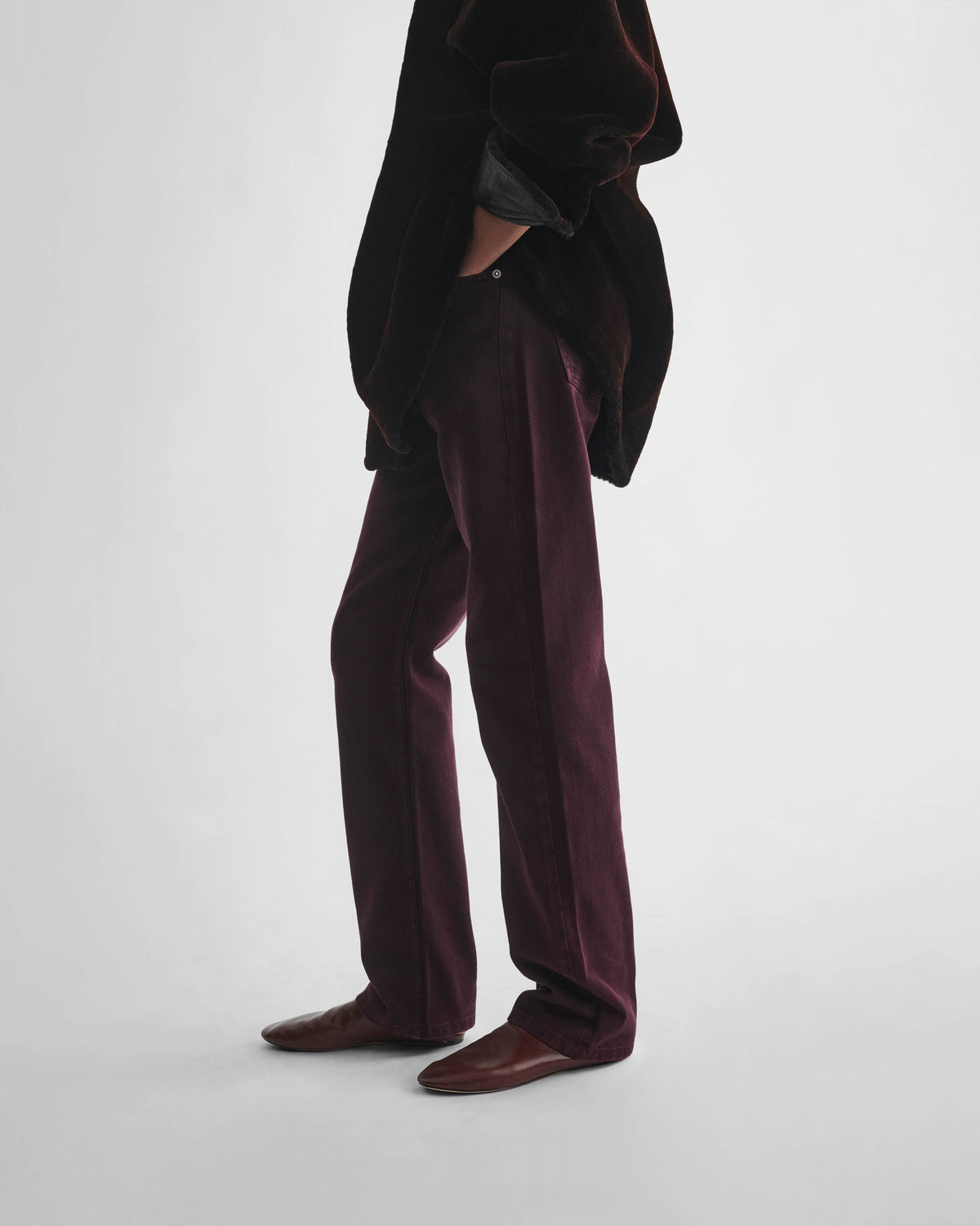 Side view of model wearing CLASSIC JEANS in dark berry cotton