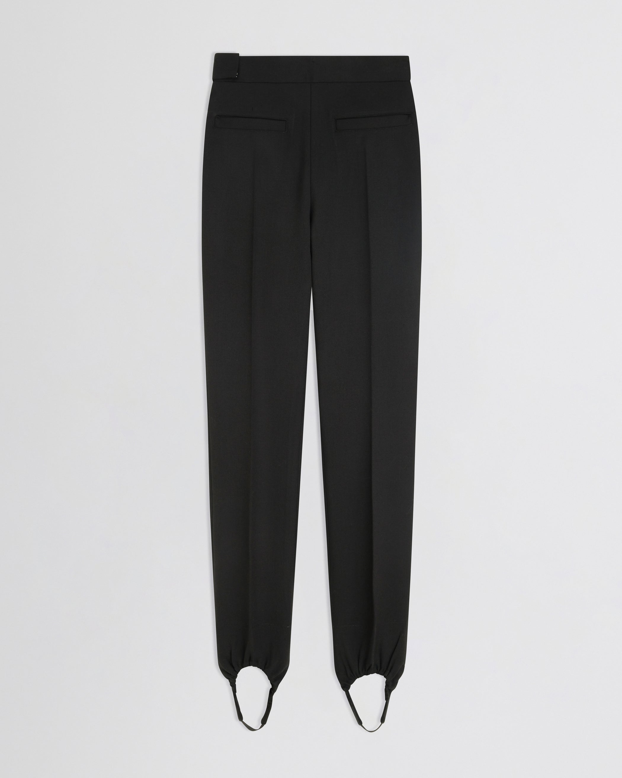 Flat back view of Stirrup Trousers in black wool