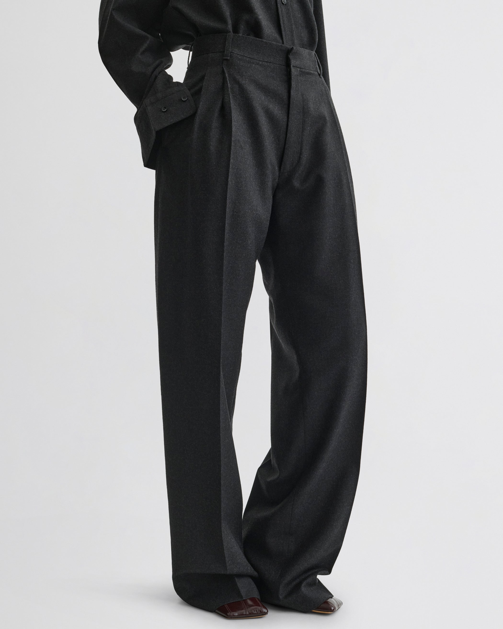 Side view of Double Pleat Trousers in charcoal wool