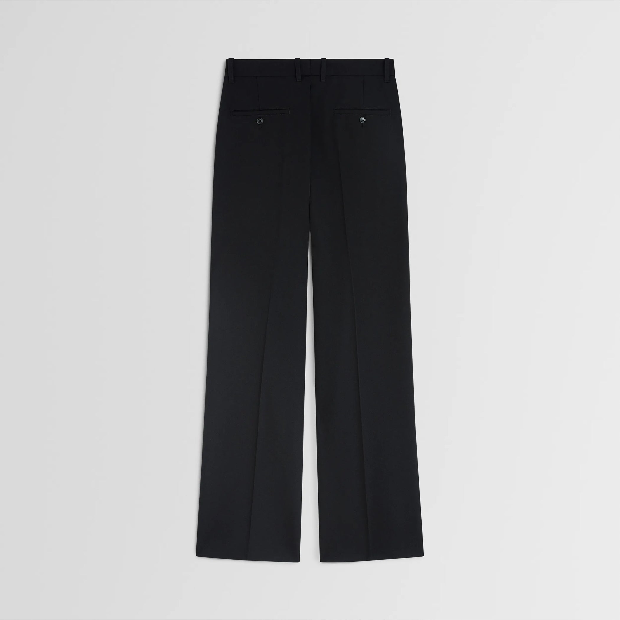 Flat back view of boyish tailored trousers in black wool