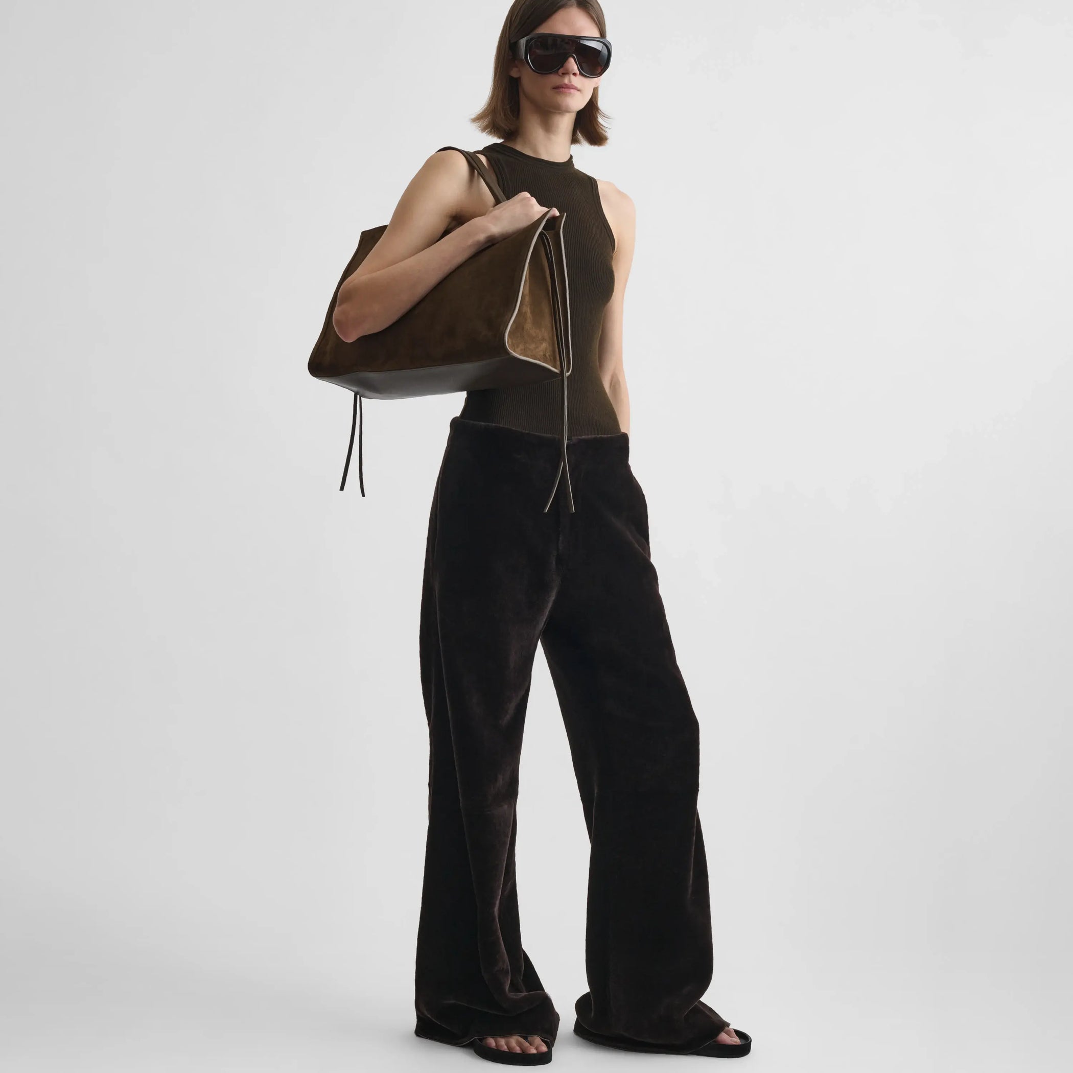 Front full body view of model wearing buzzed trousers in caviar shearling