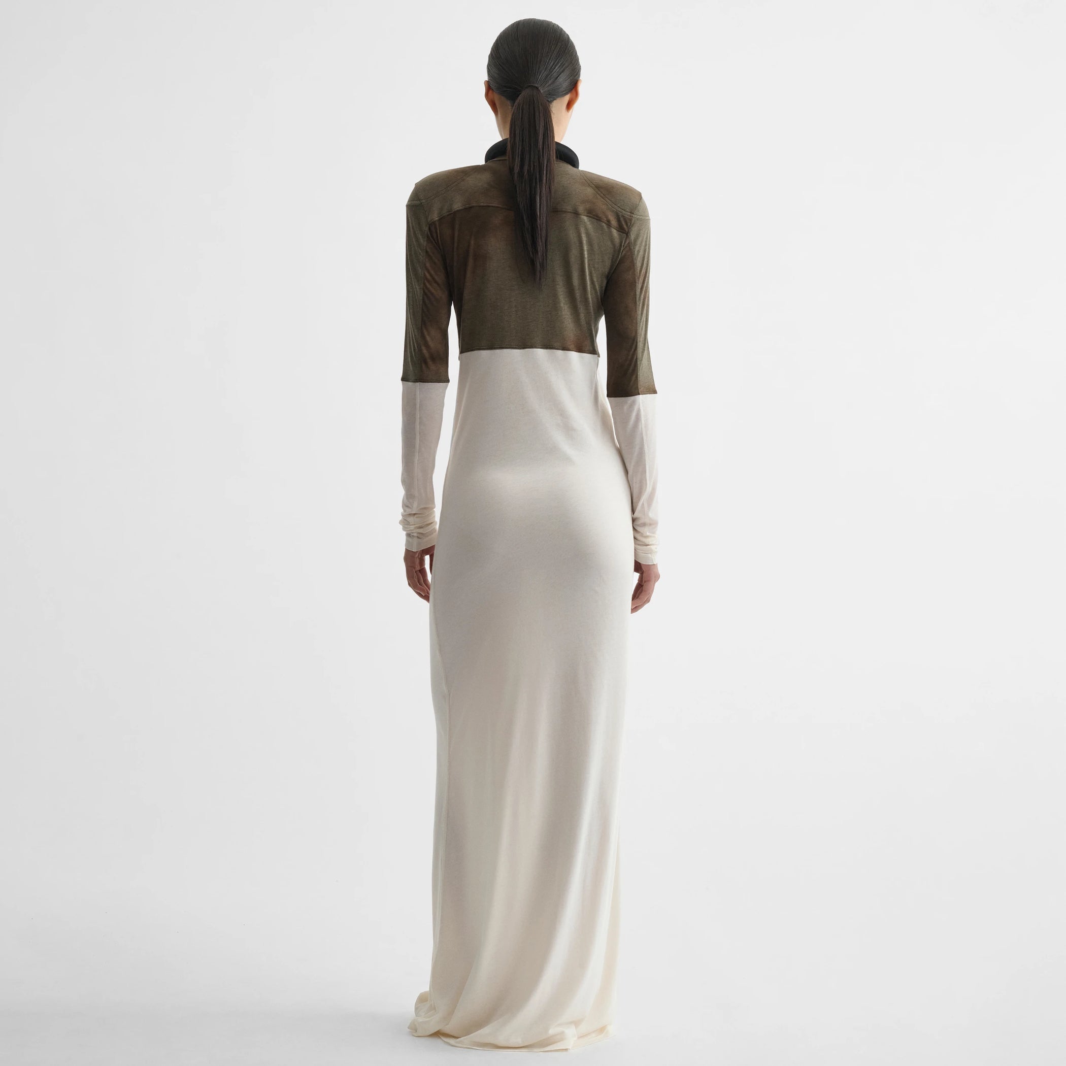 Back view of model wearing tubular liner dress in tobacco ivory cotton.