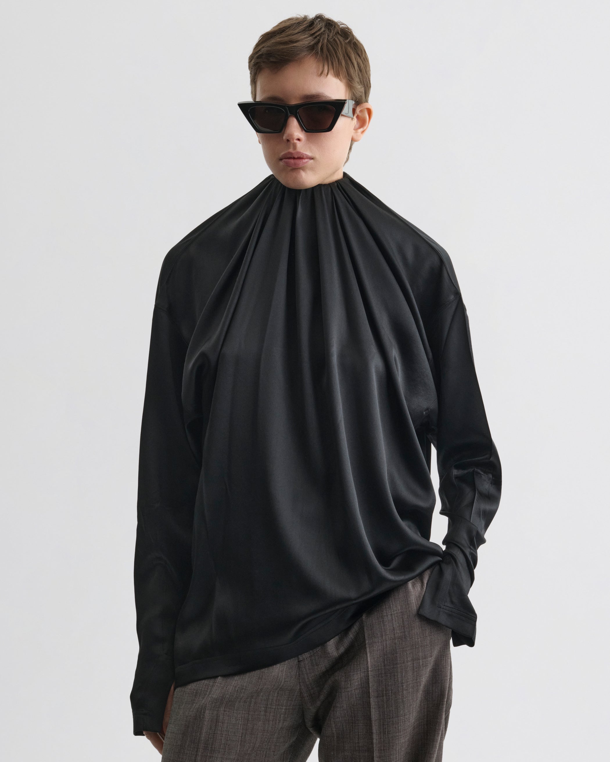 Front view of model wearing LIQUID SOFT RIDGE TOP in black silk