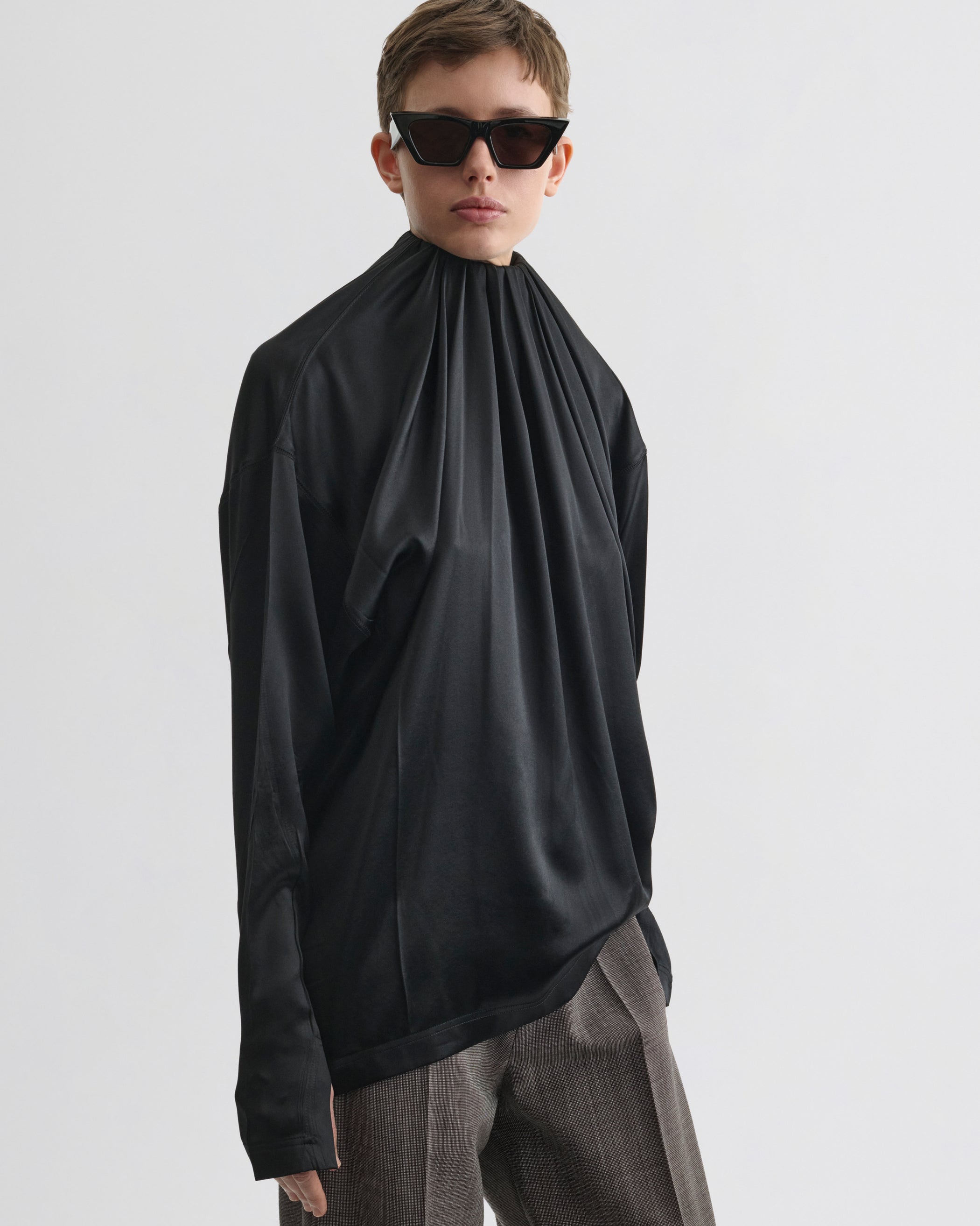 Front view of model wearing LIQUID SOFT RIDGE TOP in black silk