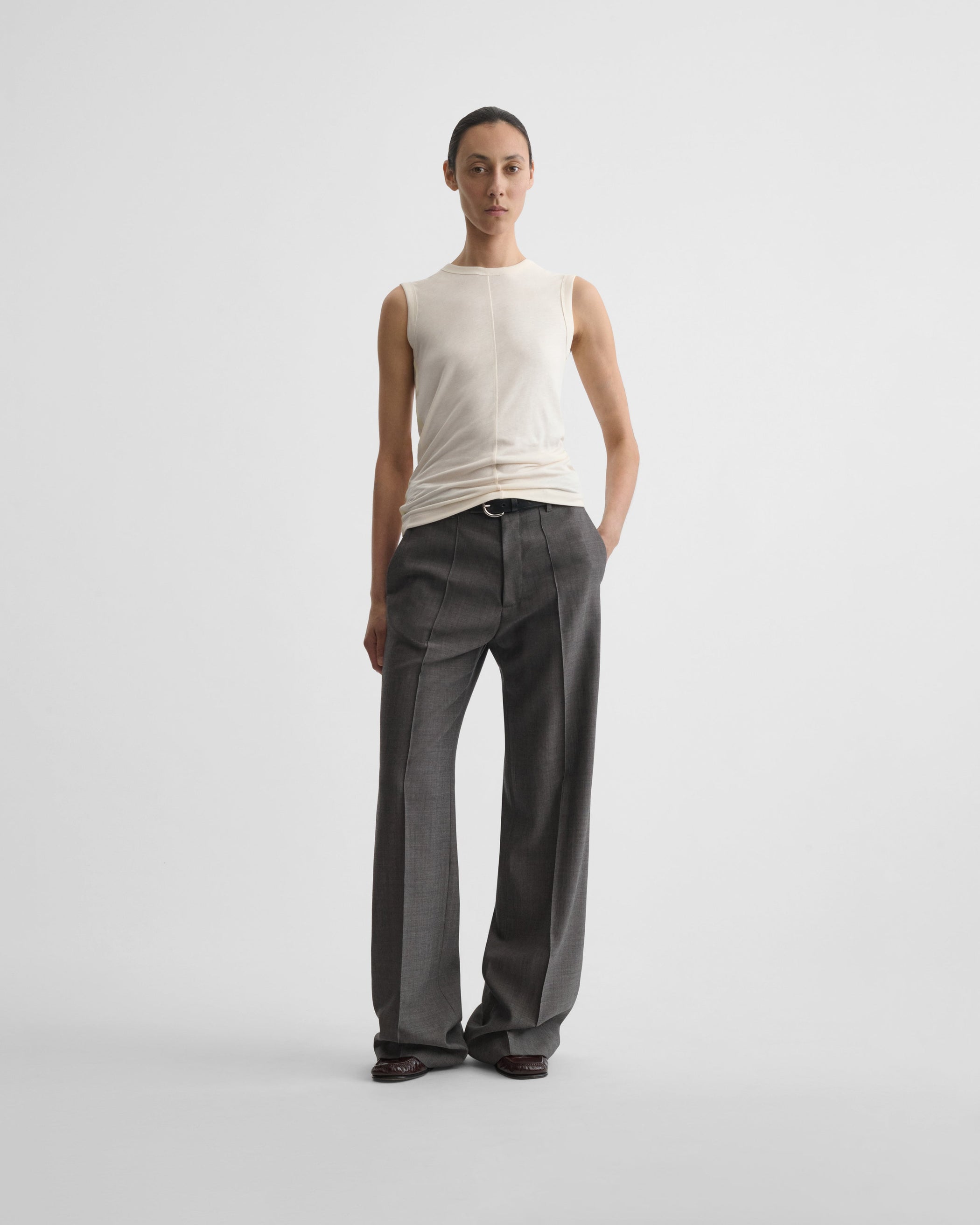 Full length front view of model wearing UNDERPINNING TANK TOP in ivory cotton