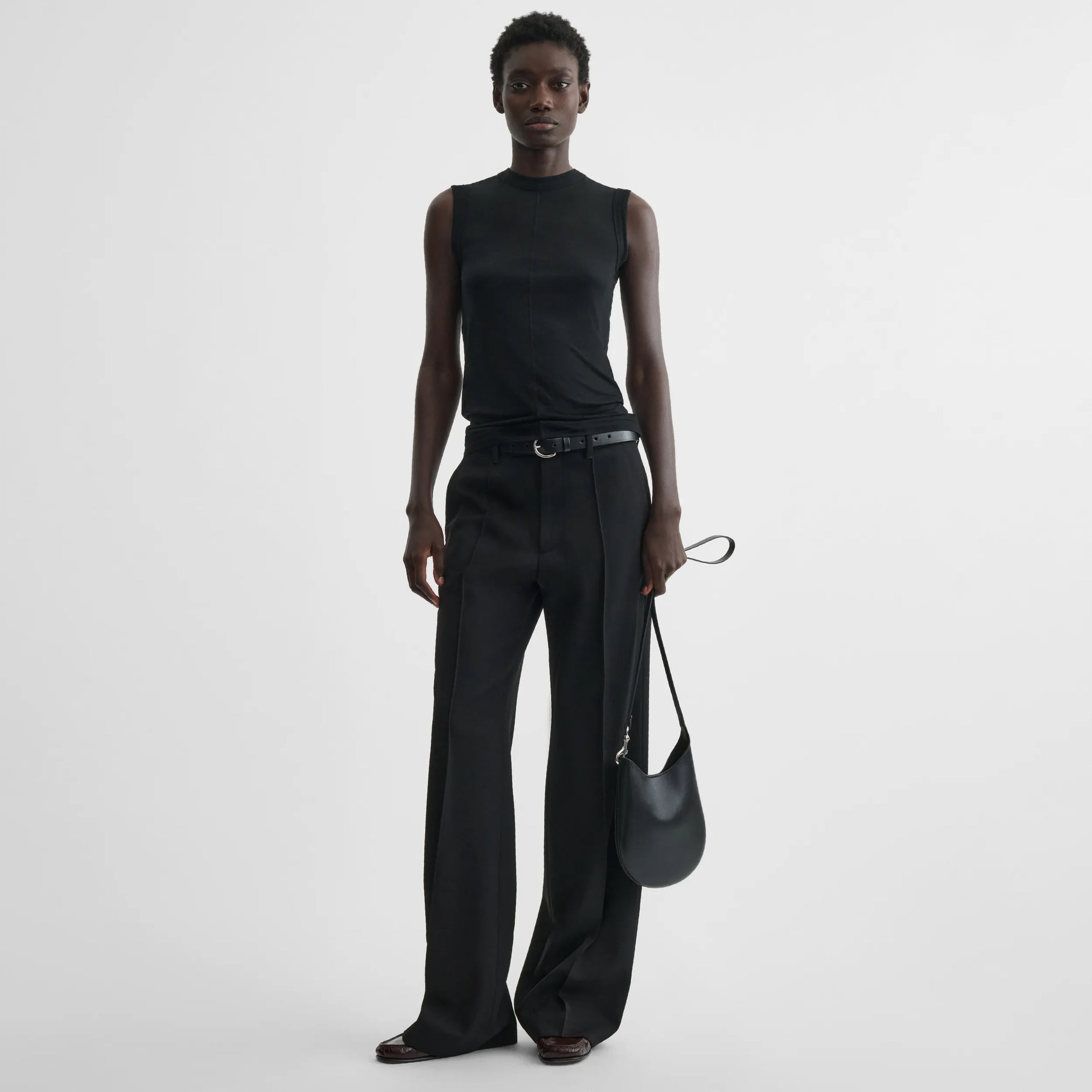 Front view of underpinning tank top in black cotton