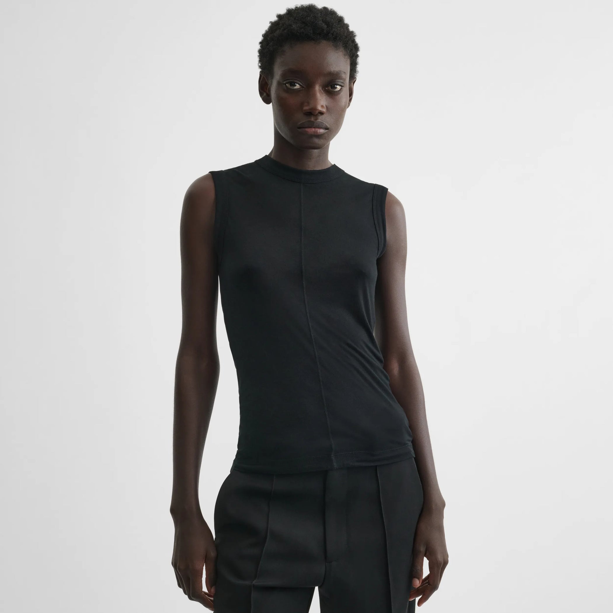 Front view of underpinning tank top in black cotton