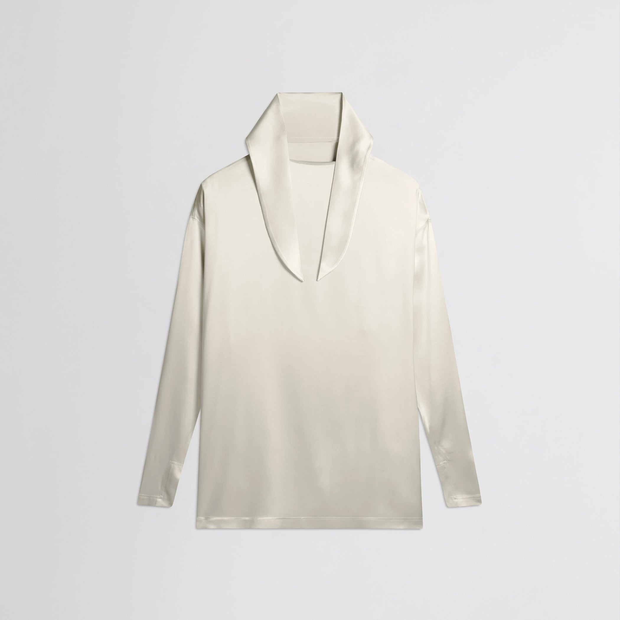 Flat front view of liquid knot collar top in cream silk.