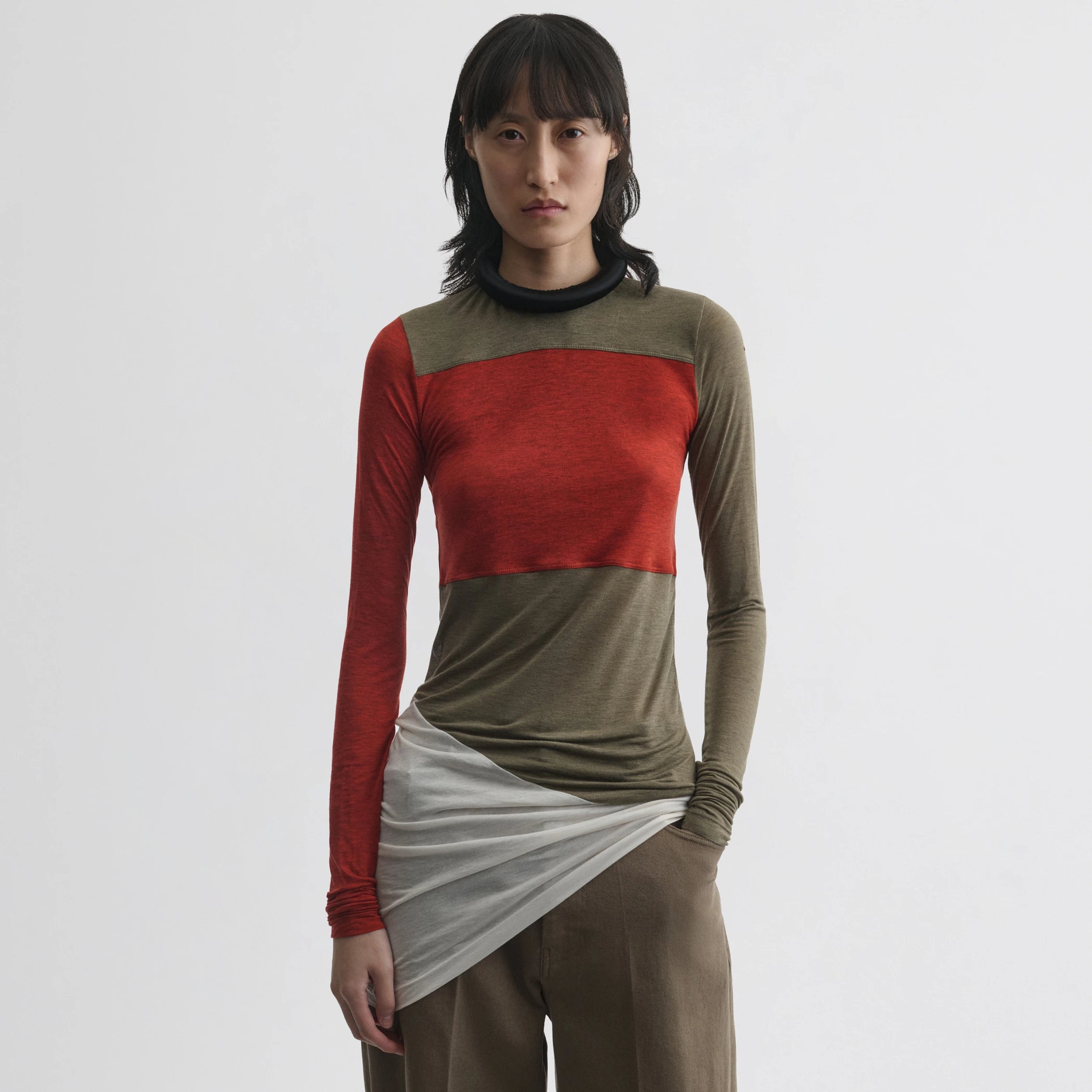 Front view of model wearing tubular colour block top in ivory tobacco red cotton.