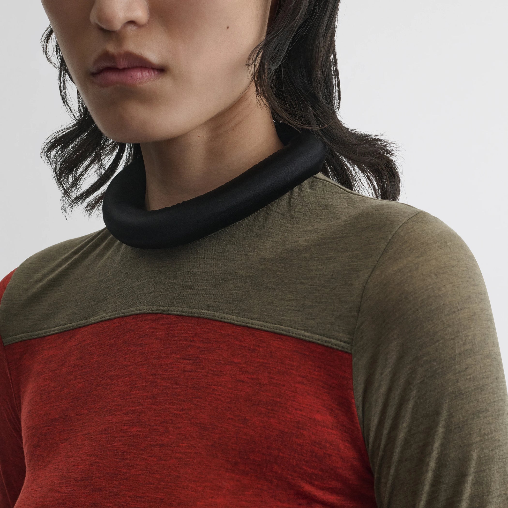 Close up detail view of tubular colour block top in ivory tobacco red cotton.