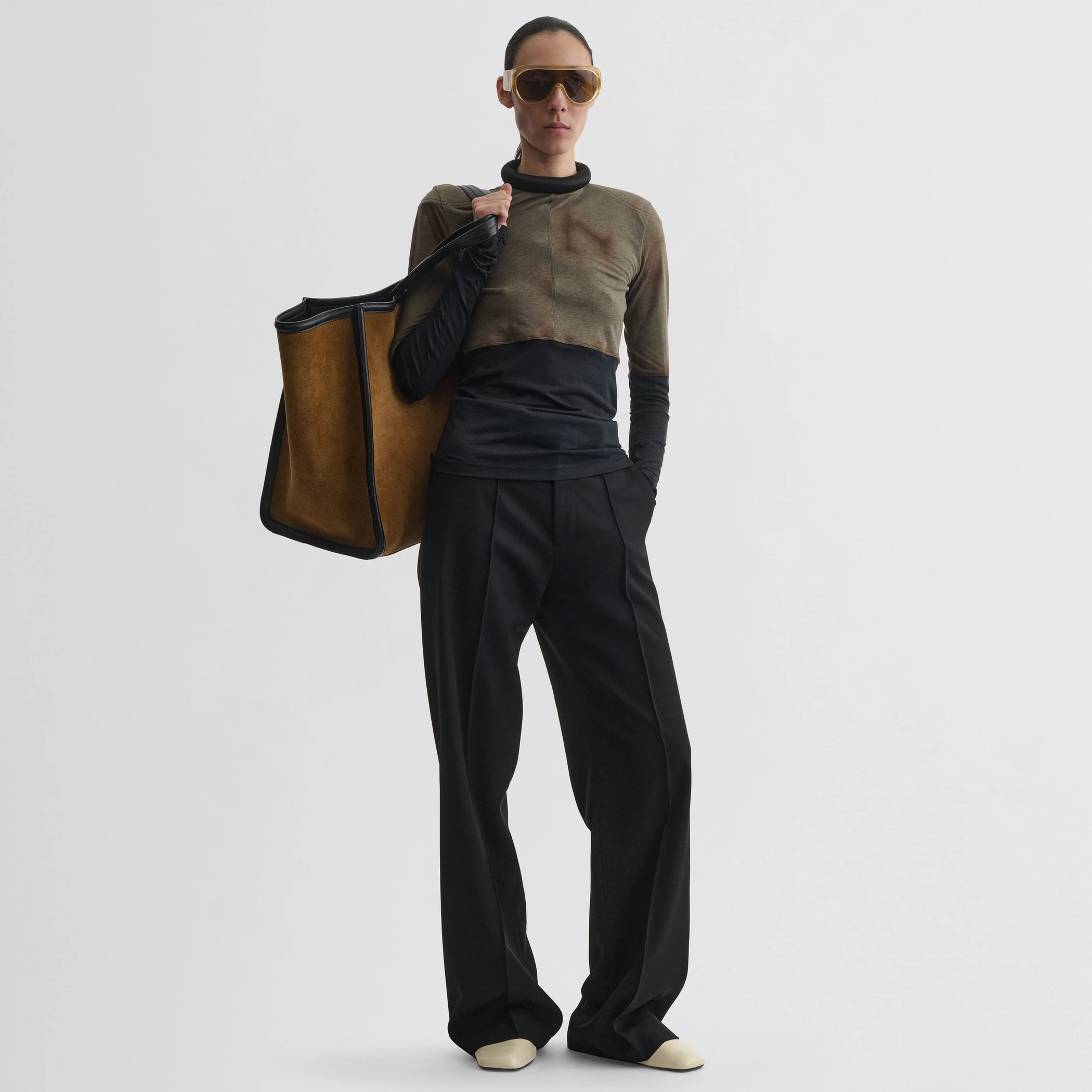 Front view of model wearing tubular top in tobacco black cotton.