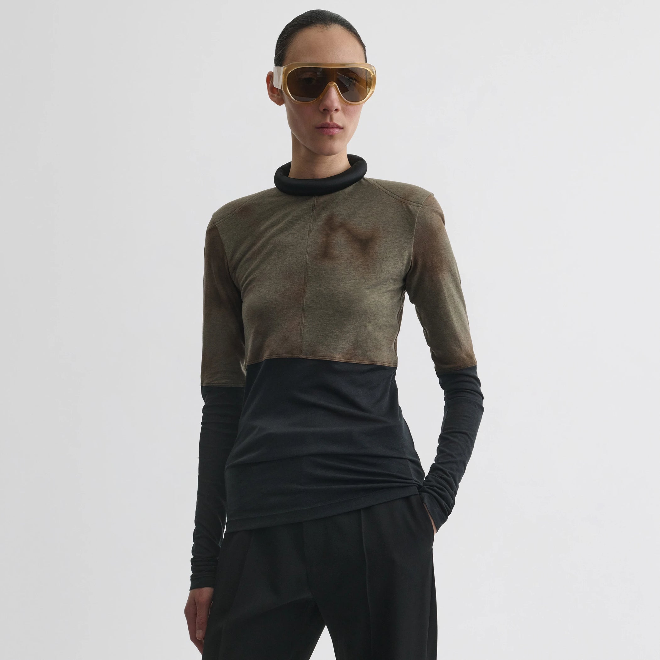 Front view of model wearing tubular top in tobacco black cotton.