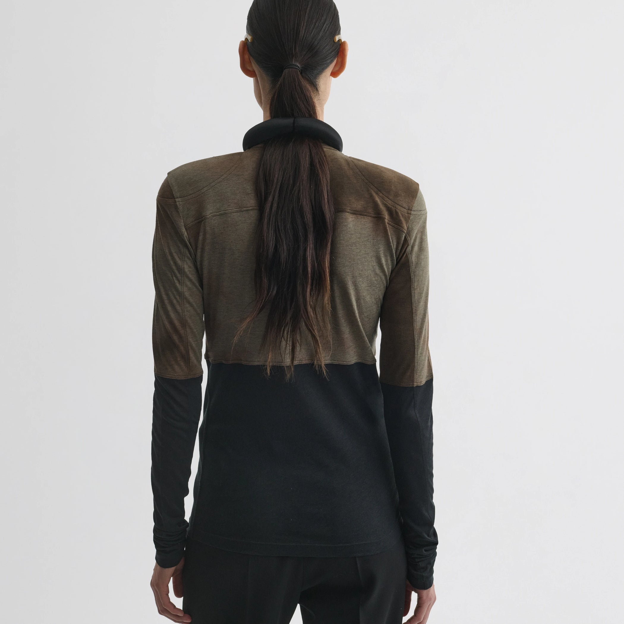 Back view of model wearing tubular top in tobacco black cotton.