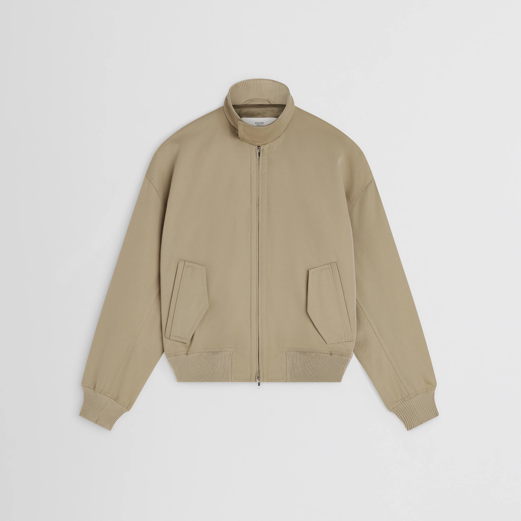 Flat front view of golf jacket in trench cotton.