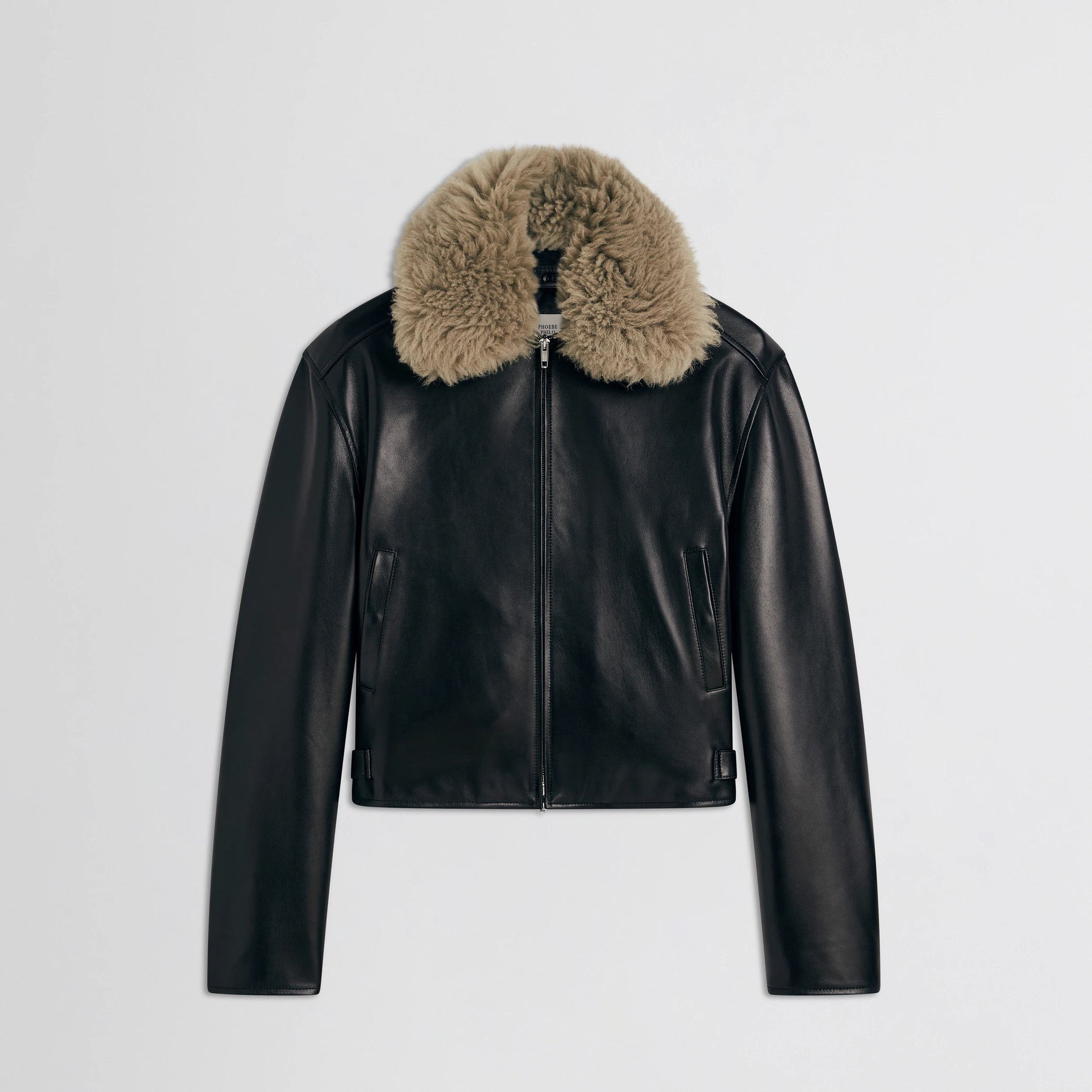 Flat front view of cropped aviator jacket in black leather.